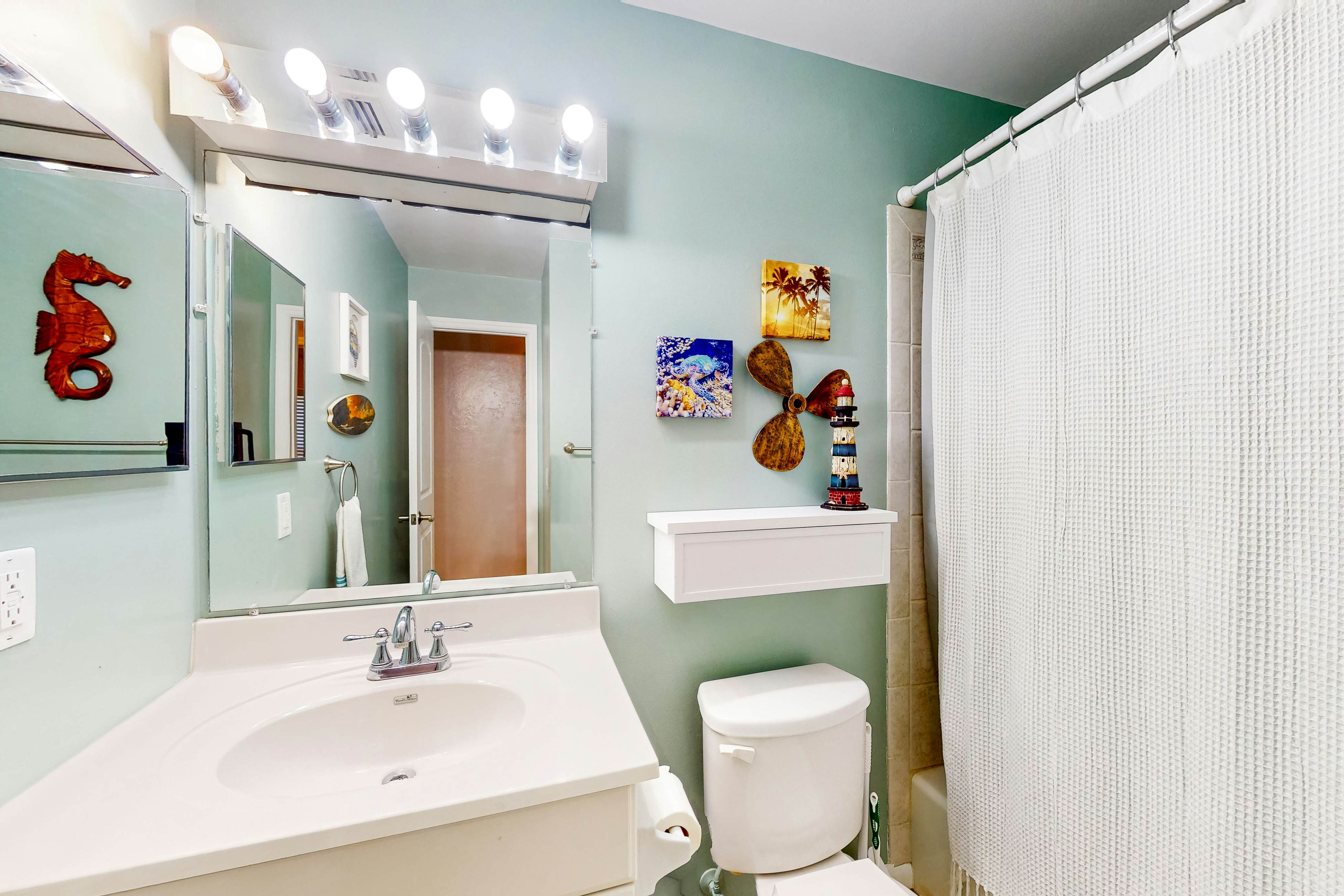 Dog-friendly house with patio, firepit, fenced yard, beach gear, & AC