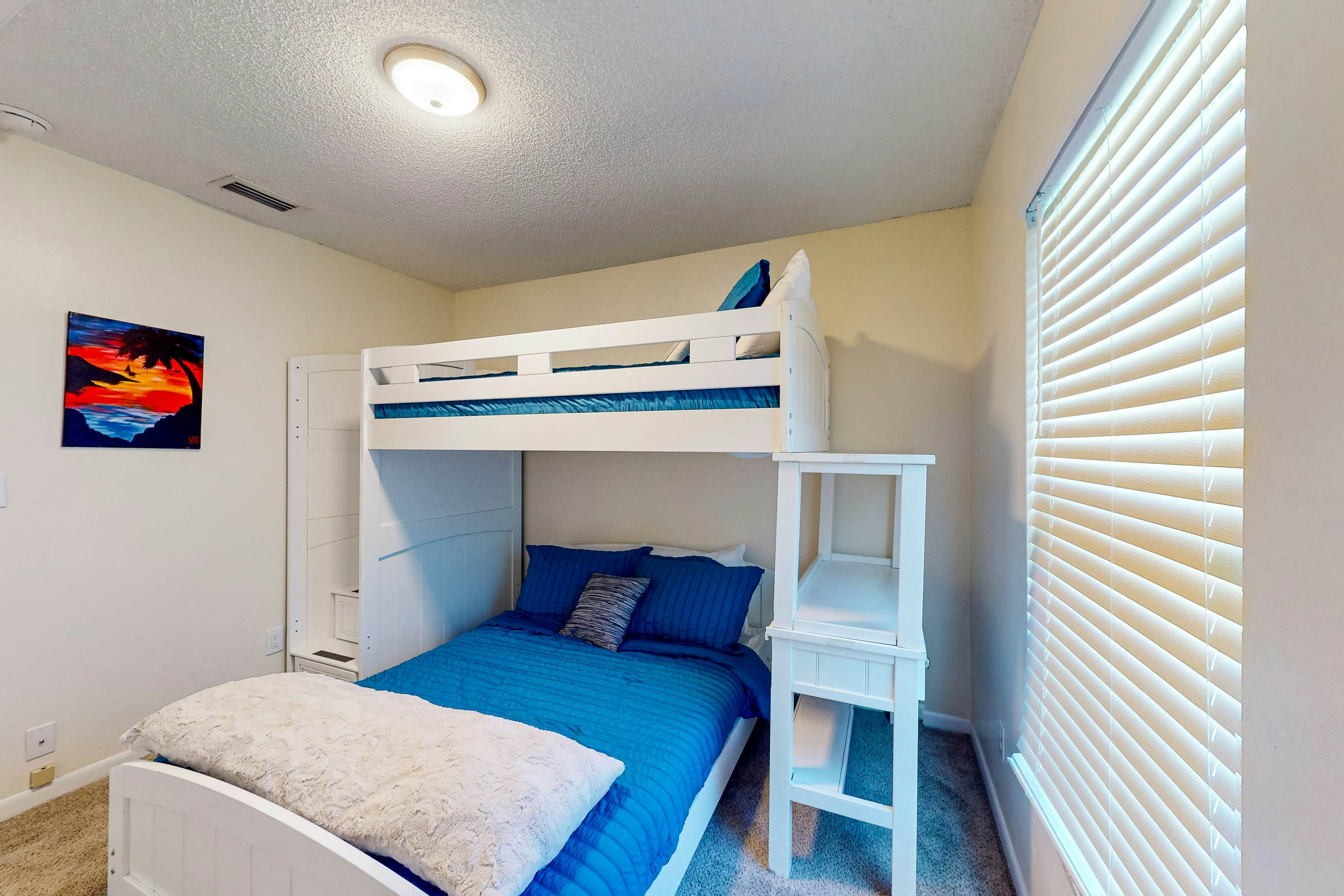 Dog-friendly house with patio, firepit, fenced yard, beach gear, & AC