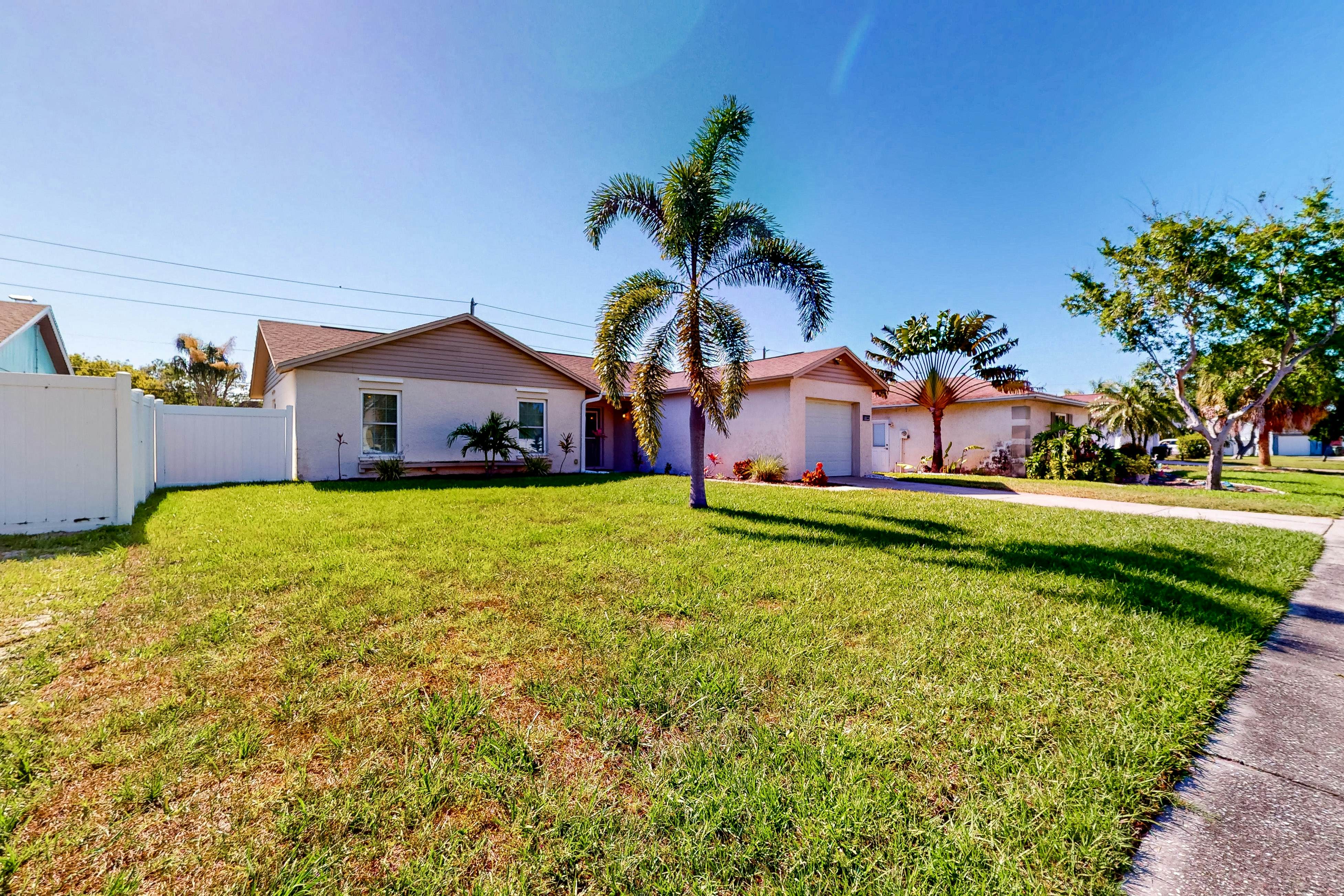 Dog-friendly house with patio, firepit, fenced yard, beach gear, & AC