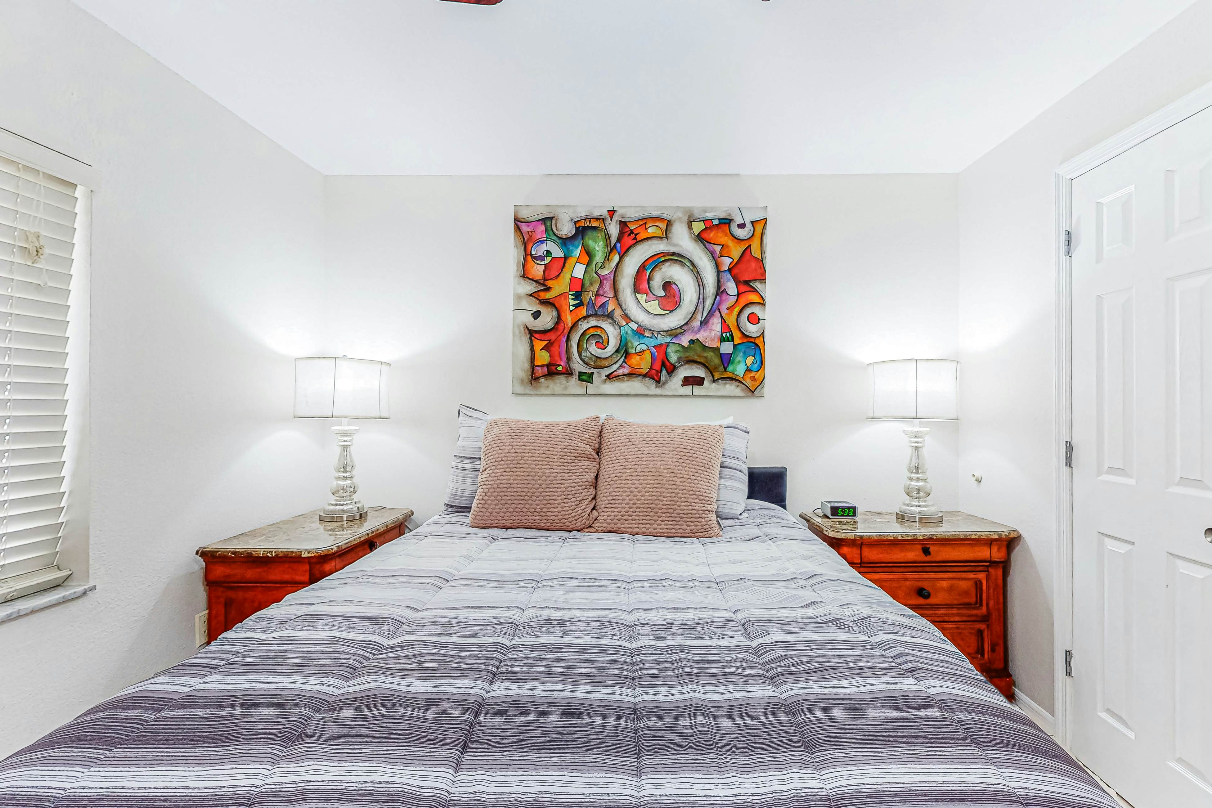 Centrally located condo with heated pool, balcony, washer/dryer & central AC