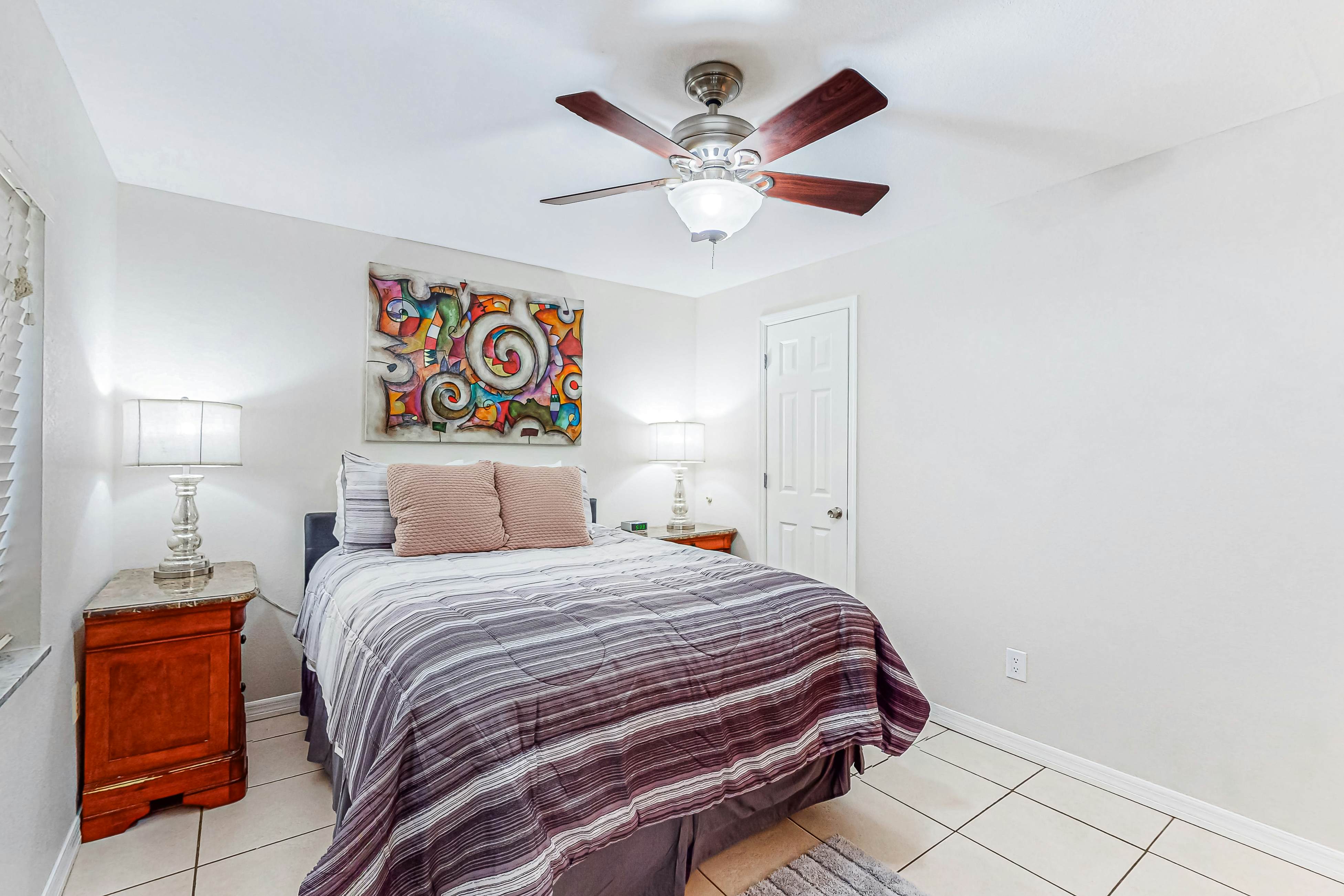 Centrally located condo with heated pool, balcony, washer/dryer & central AC