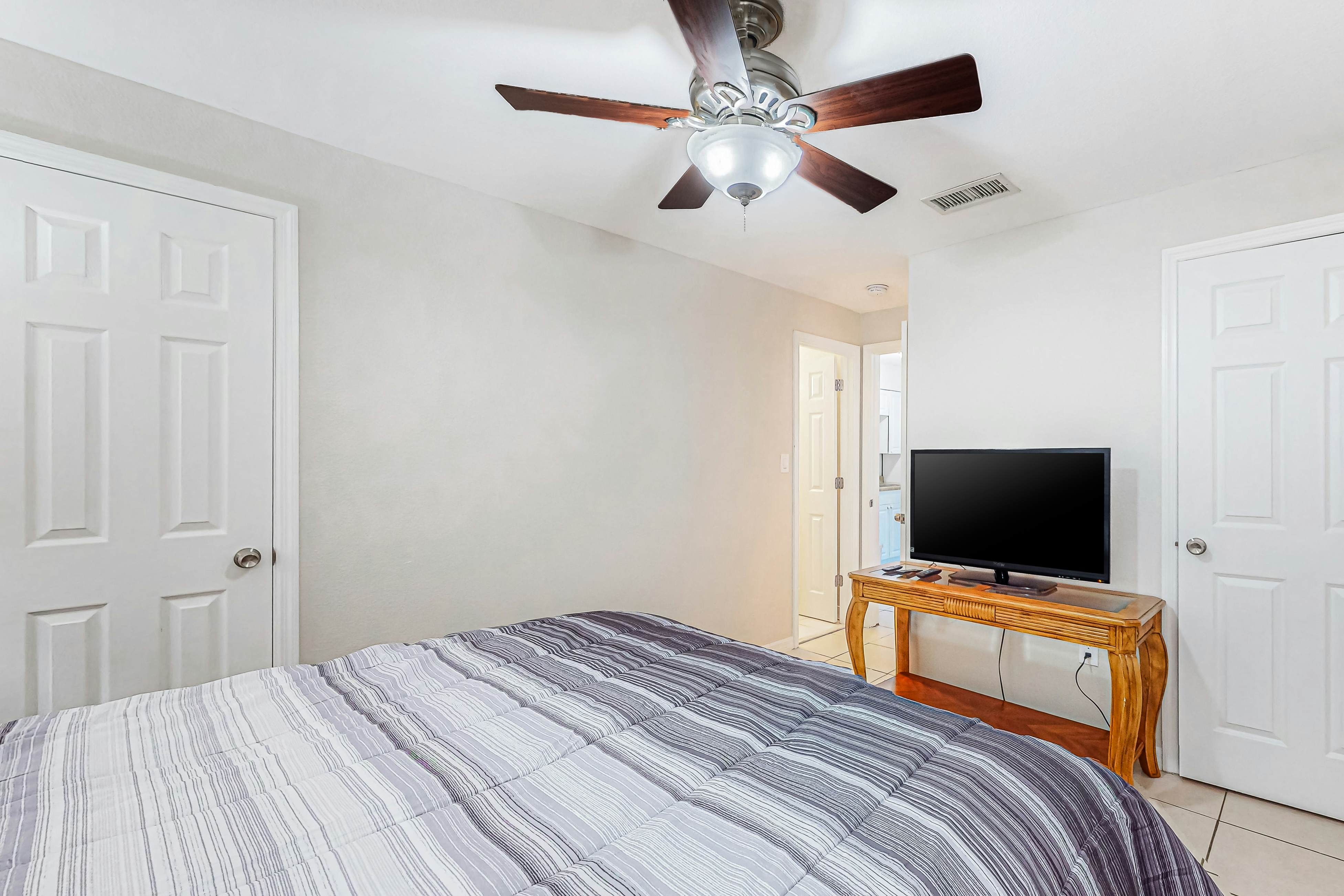 Centrally located condo with heated pool, balcony, washer/dryer & central AC