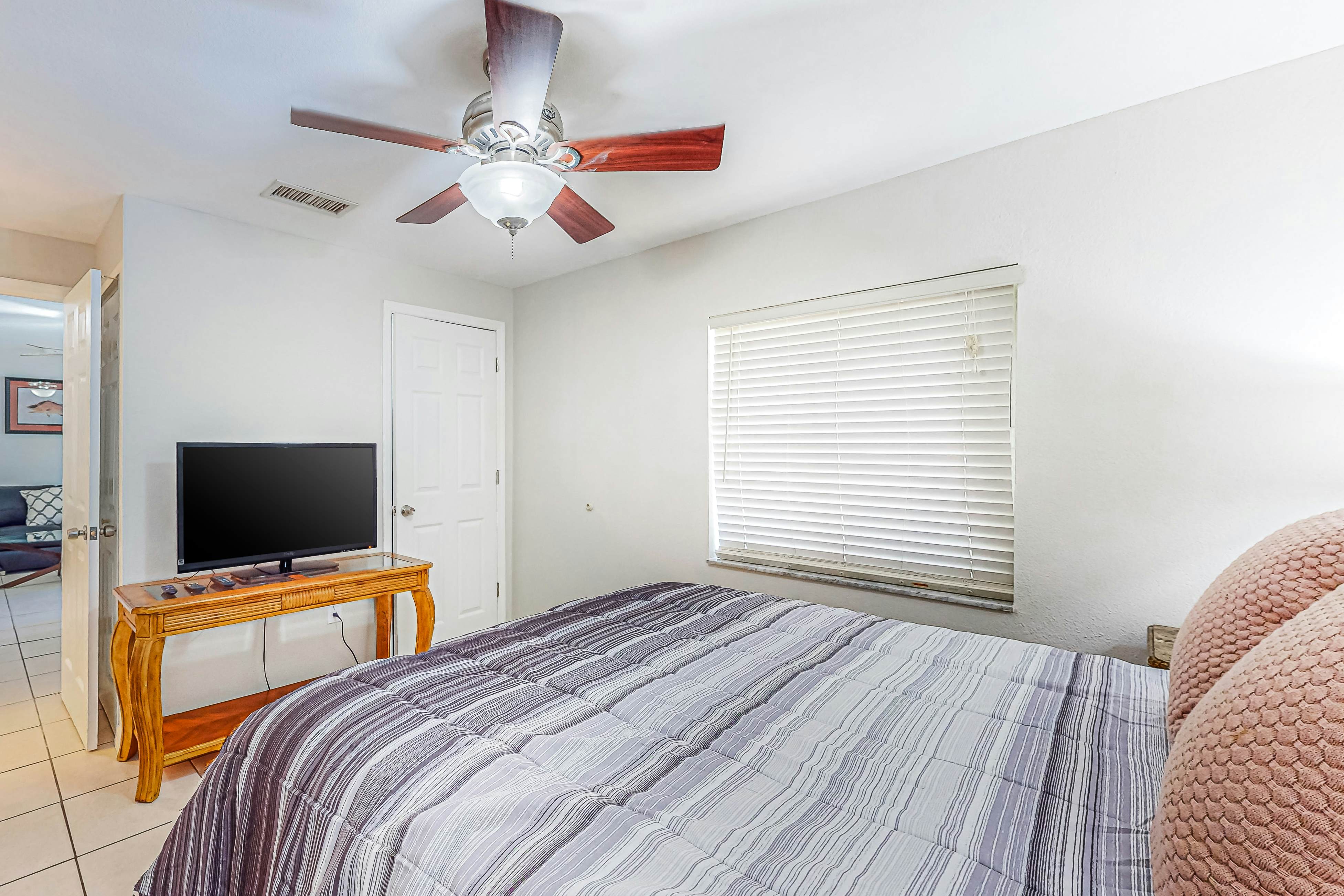 Centrally located condo with heated pool, balcony, washer/dryer & central AC