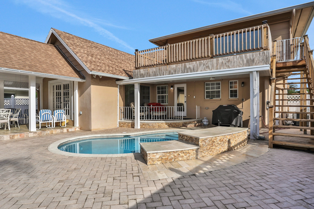 Snowbird friendly elegant home with waterfront location pool grill fireplace