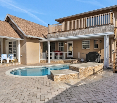 Snowbird friendly elegant home with waterfront location pool grill fireplace