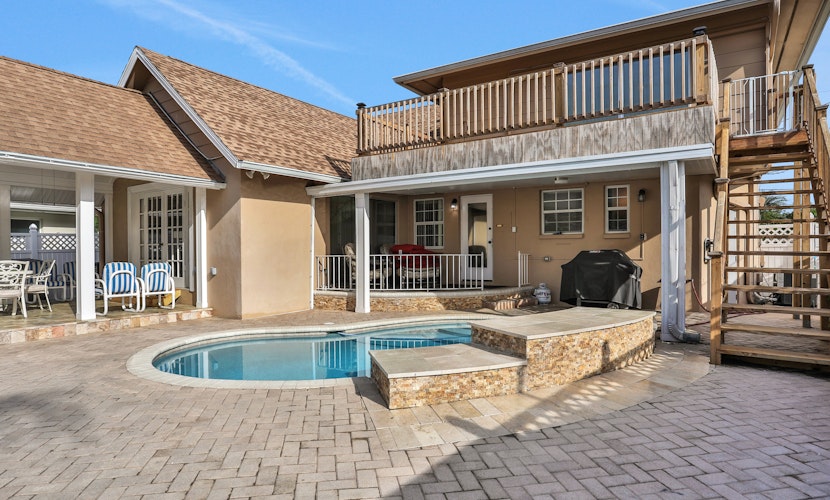 Snowbird friendly elegant home with waterfront location pool grill fireplace