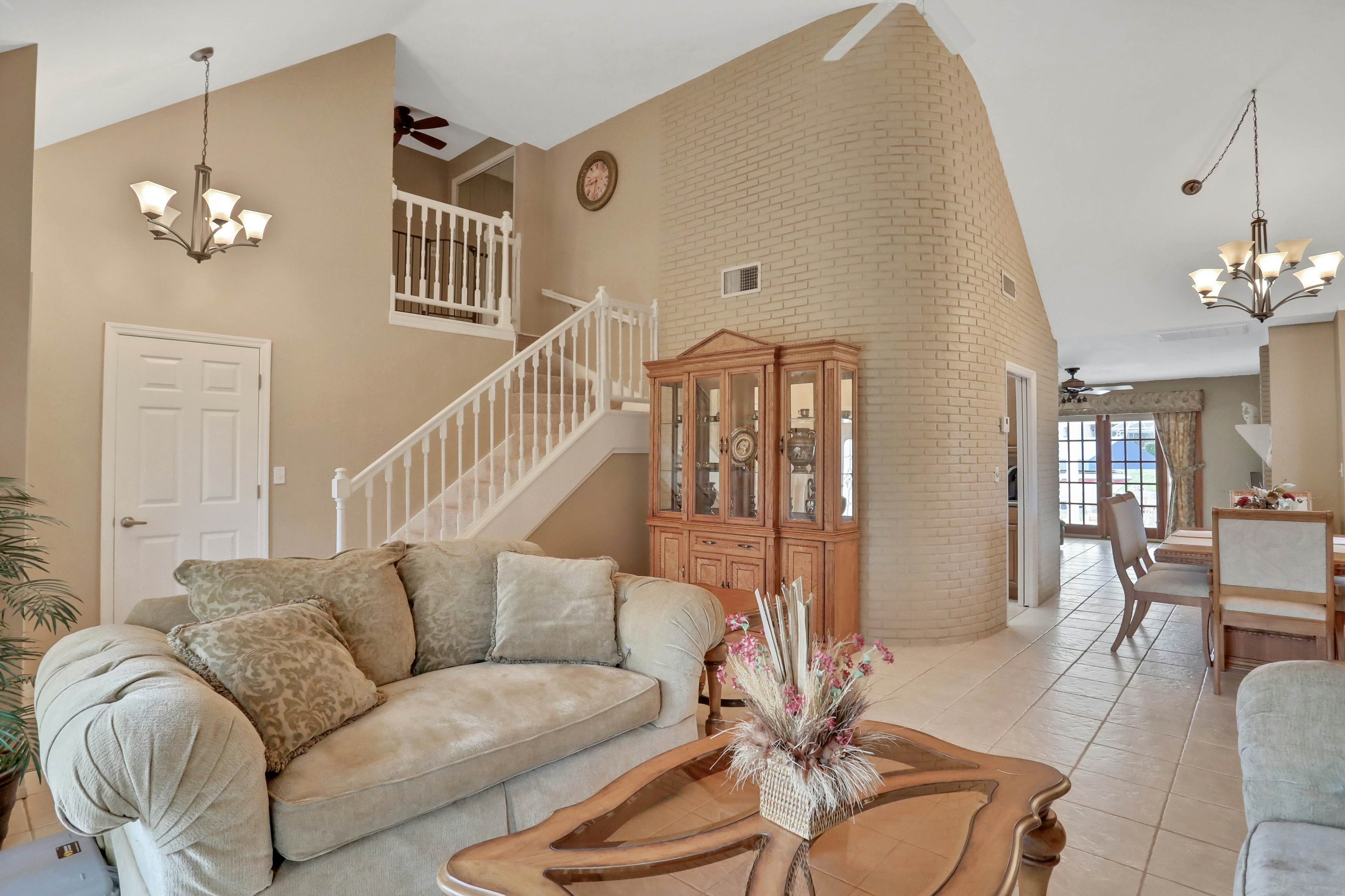 Snowbird-friendly elegant home with waterfront location, pool, grill, fireplace