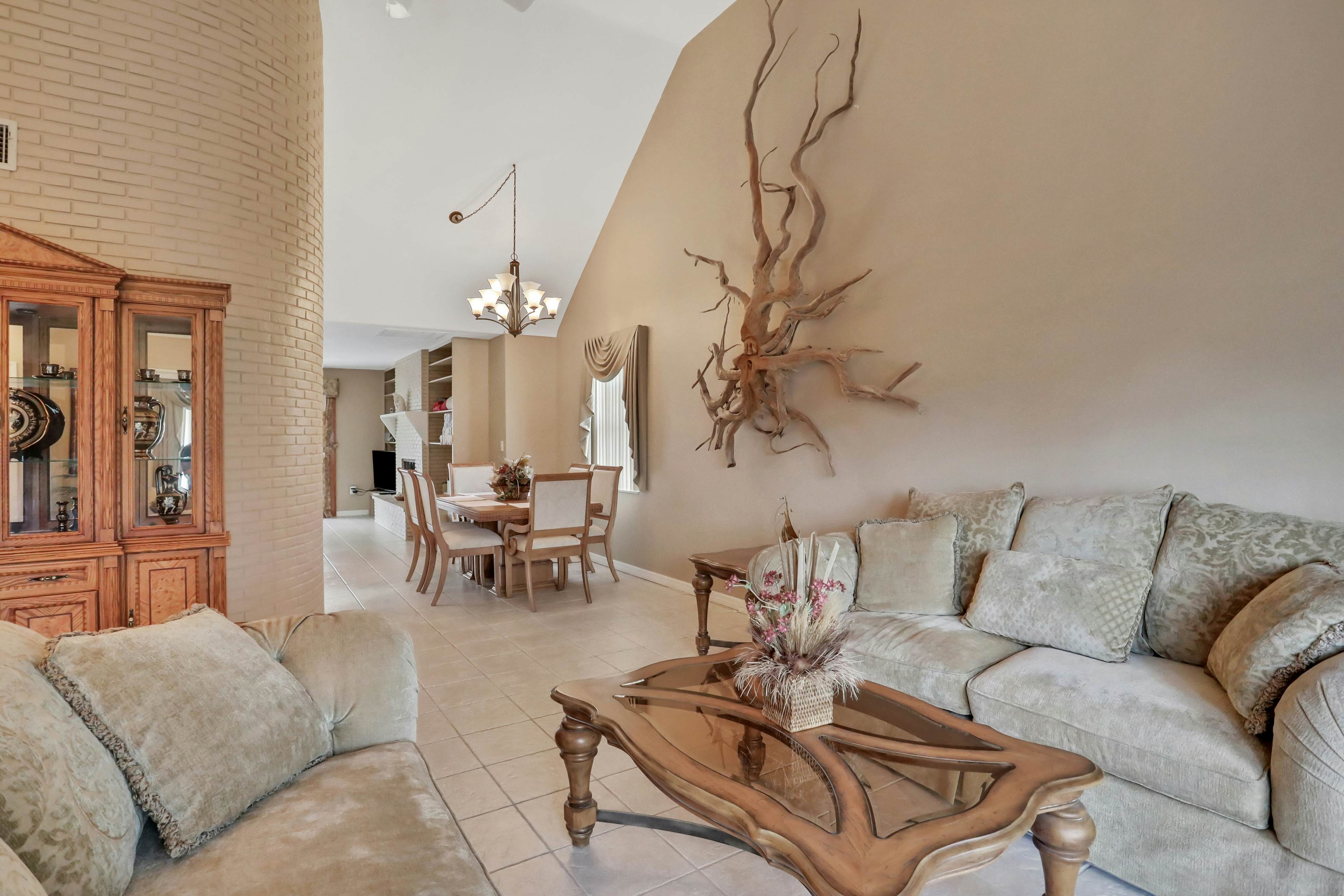 Snowbird-friendly elegant home with waterfront location, pool, grill, fireplace