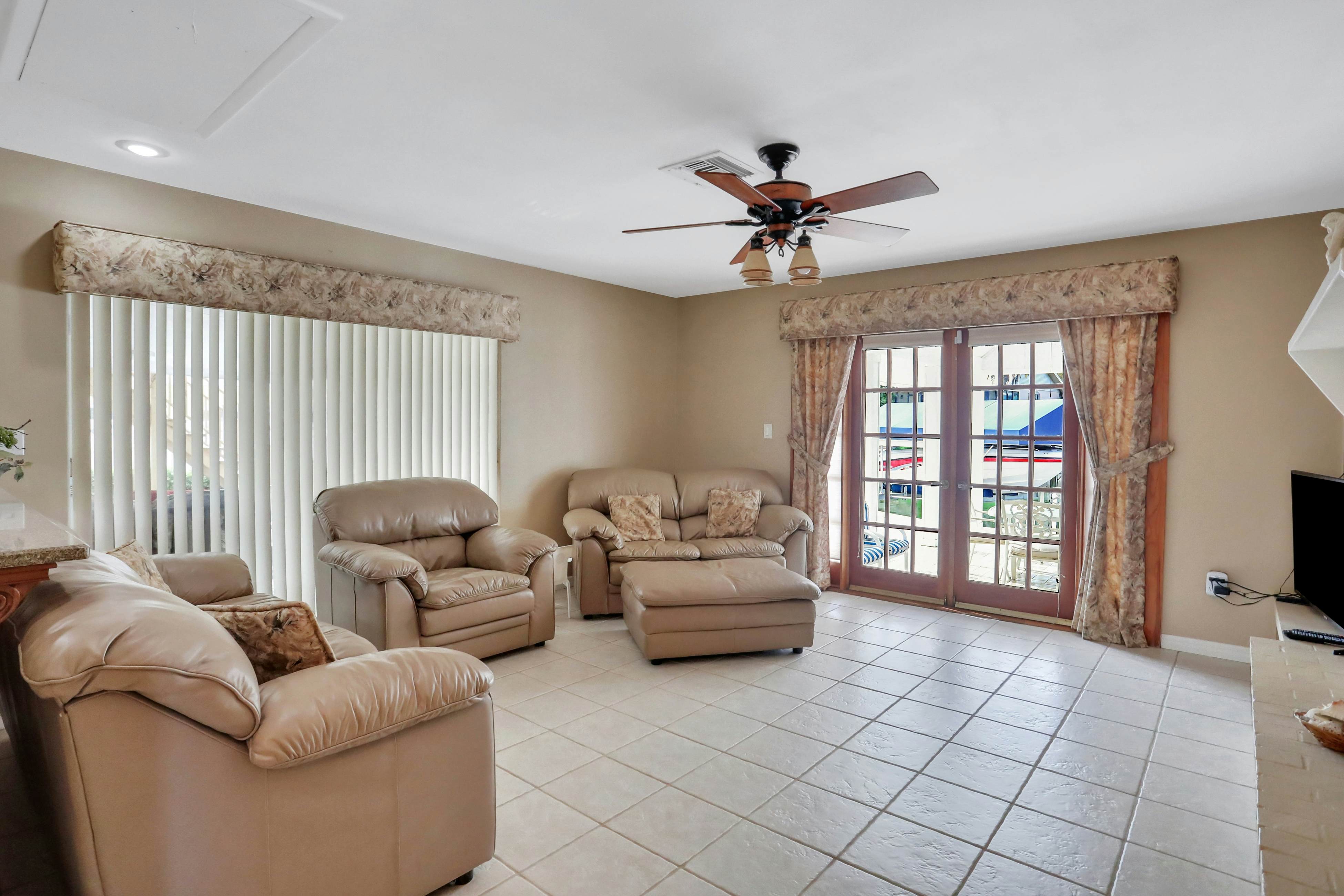 Snowbird-friendly elegant home with waterfront location, pool, grill, fireplace