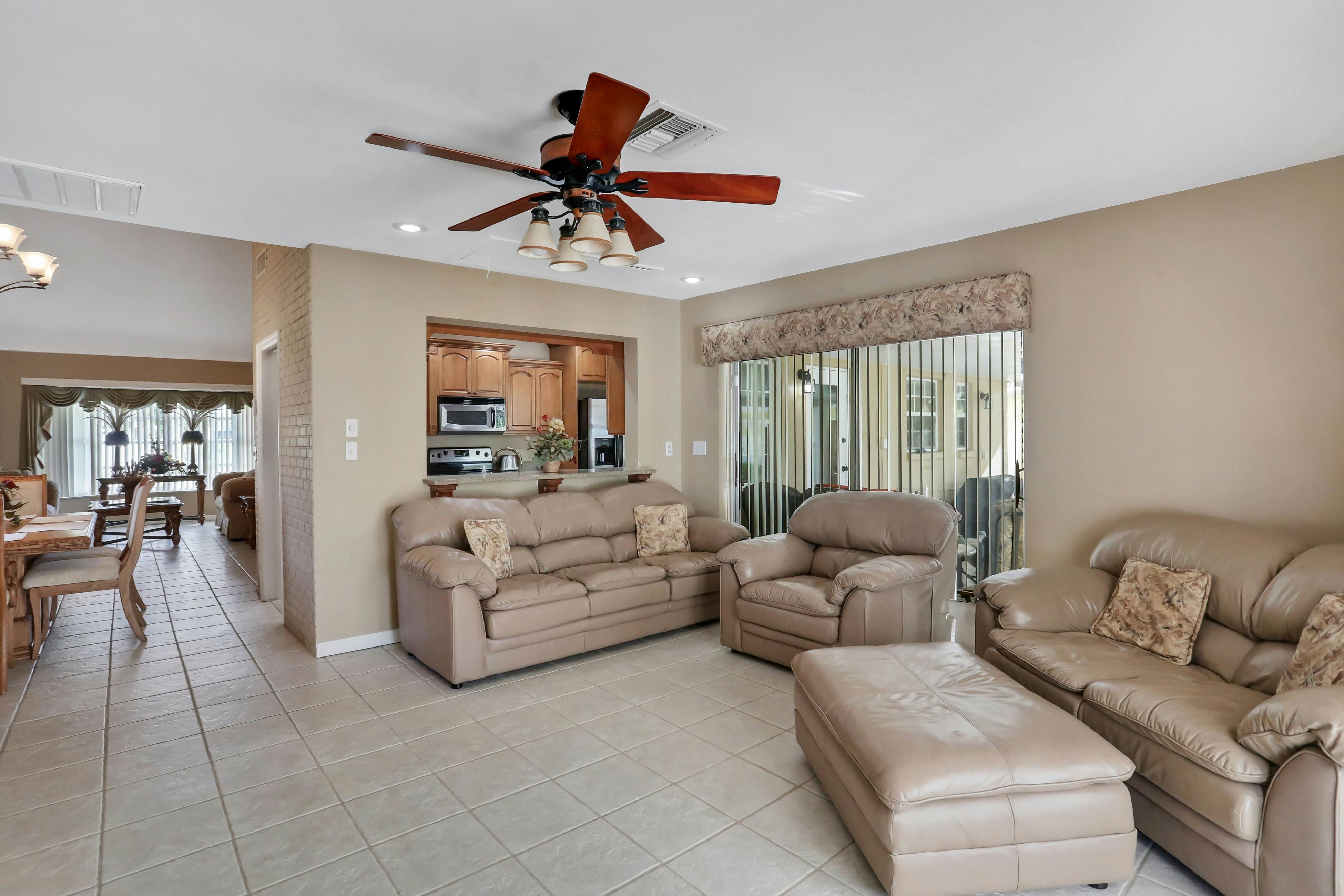 Snowbird-friendly elegant home with waterfront location, pool, grill, fireplace