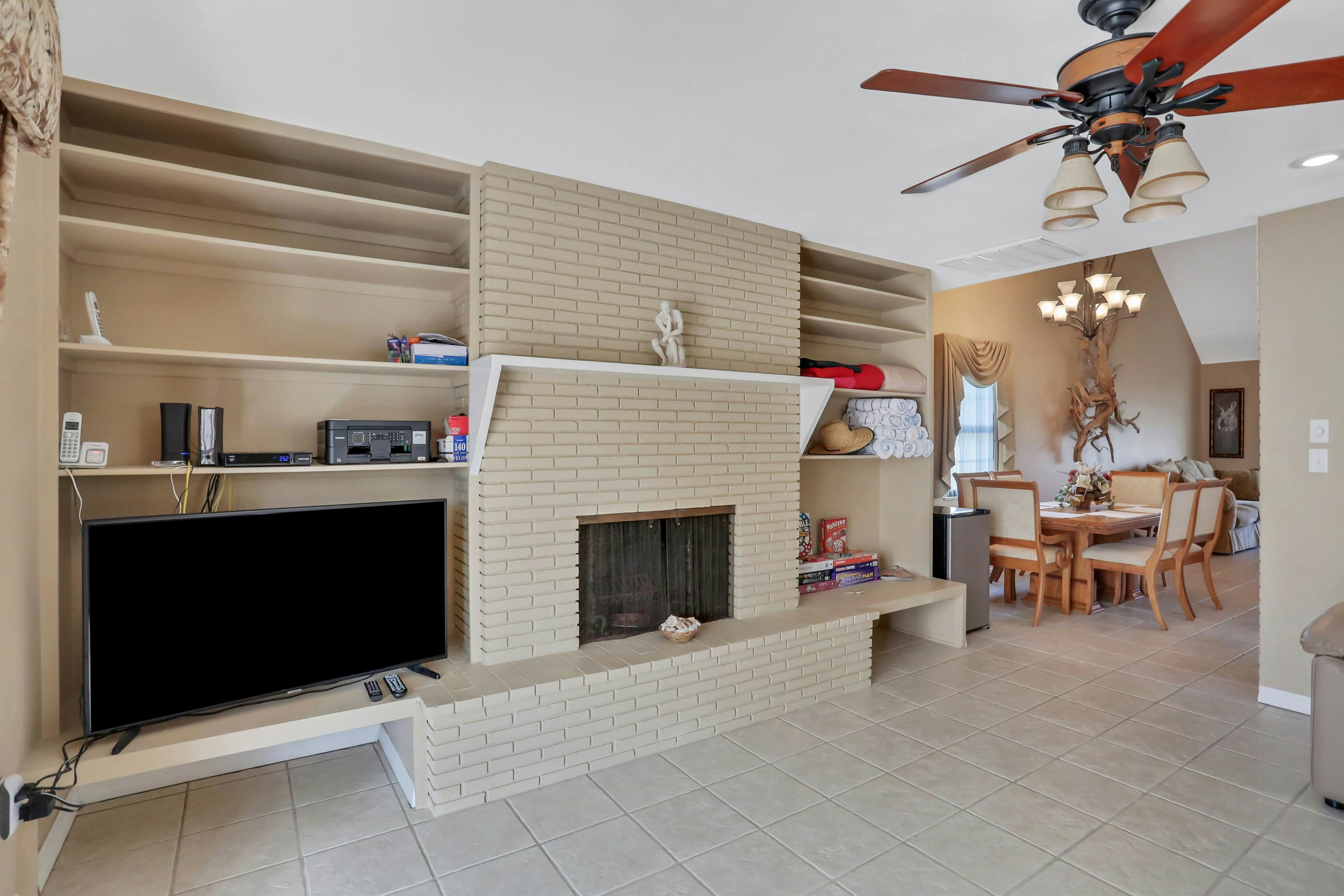 Snowbird-friendly elegant home with waterfront location, pool, grill, fireplace