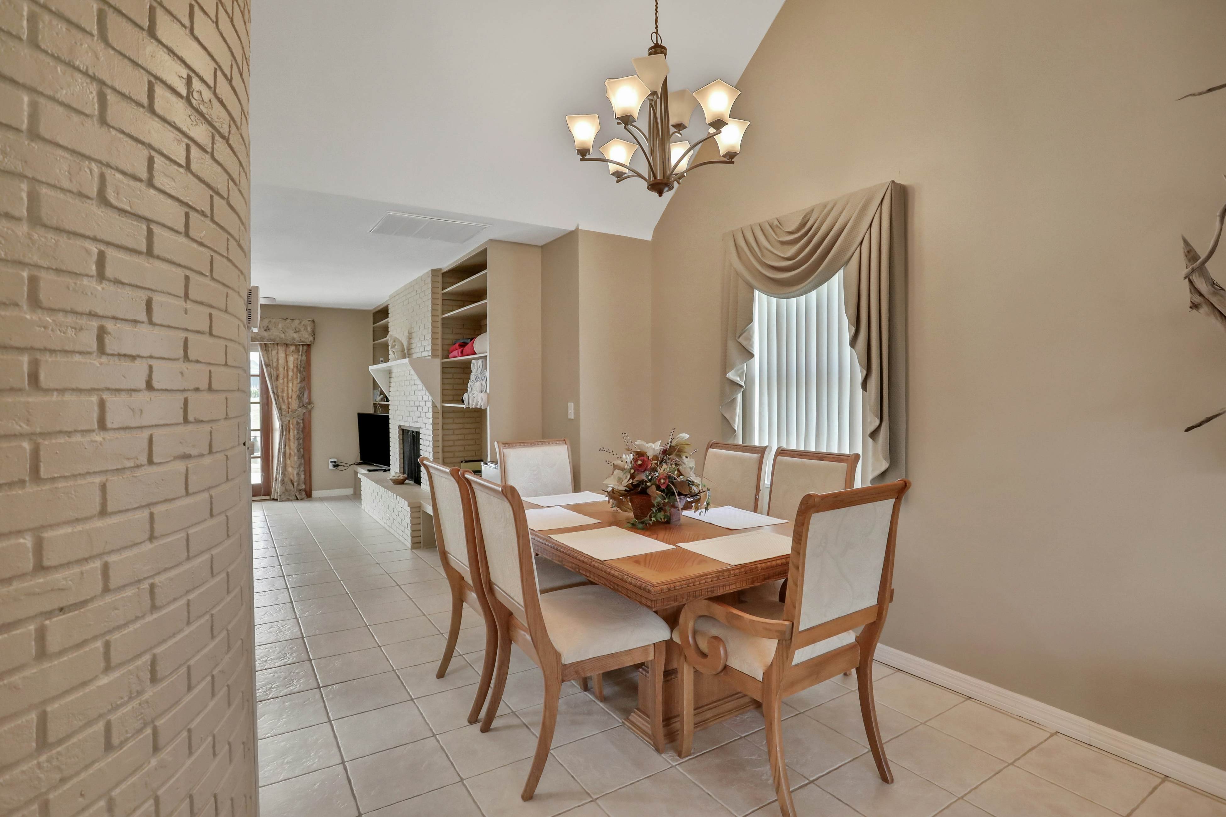 Snowbird-friendly elegant home with waterfront location, pool, grill, fireplace