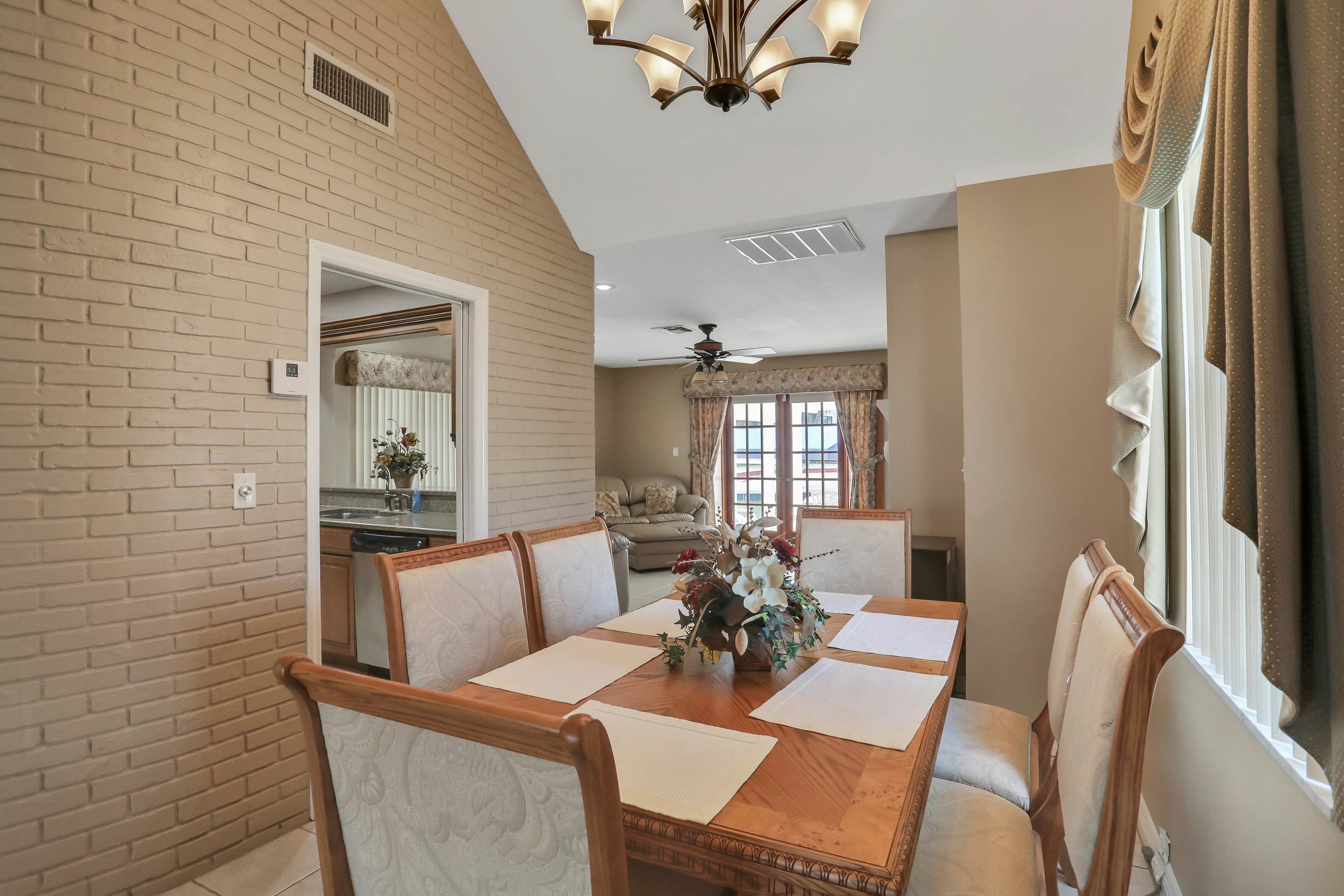 Snowbird-friendly elegant home with waterfront location, pool, grill, fireplace