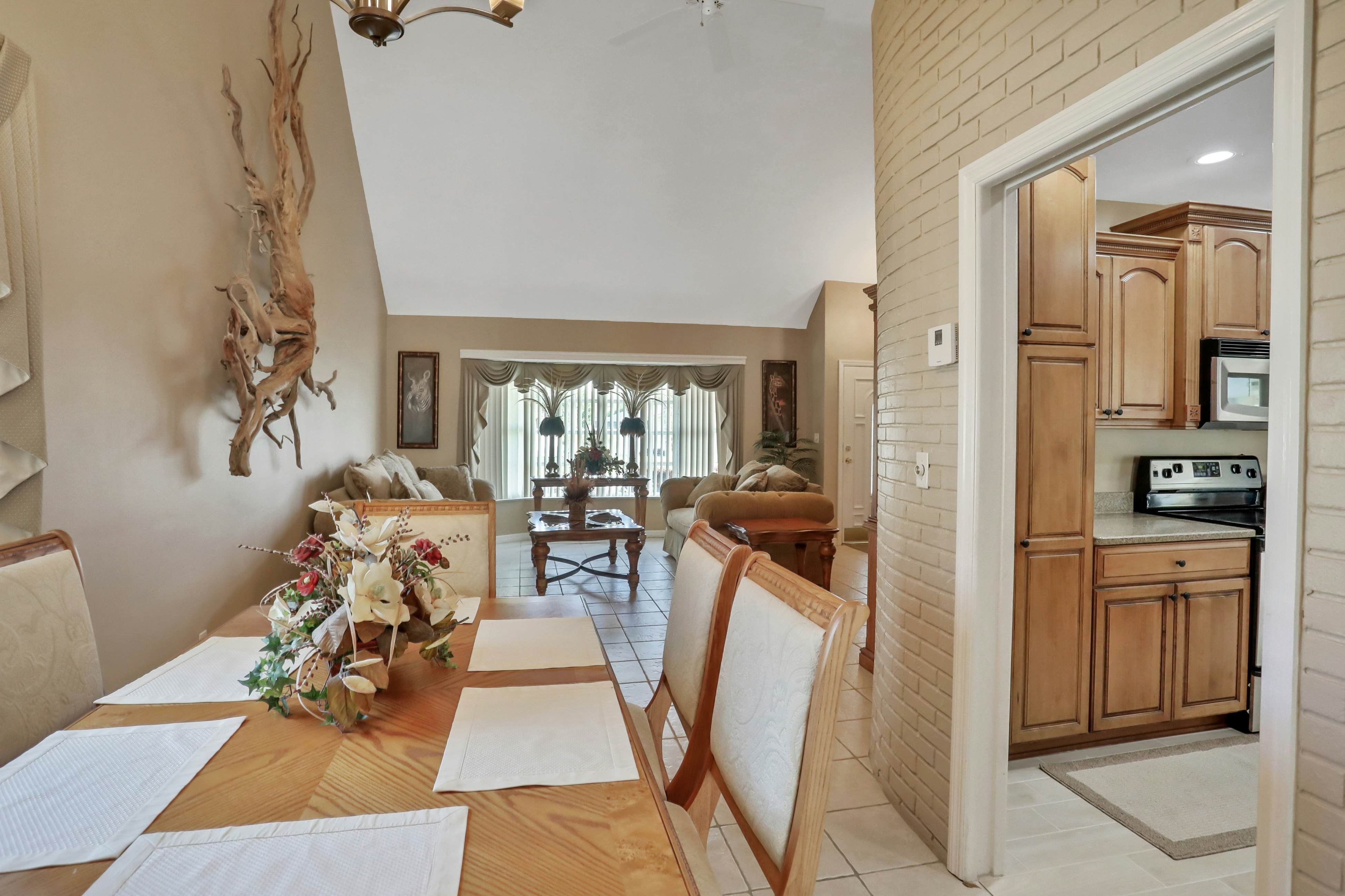 Snowbird-friendly elegant home with waterfront location, pool, grill, fireplace