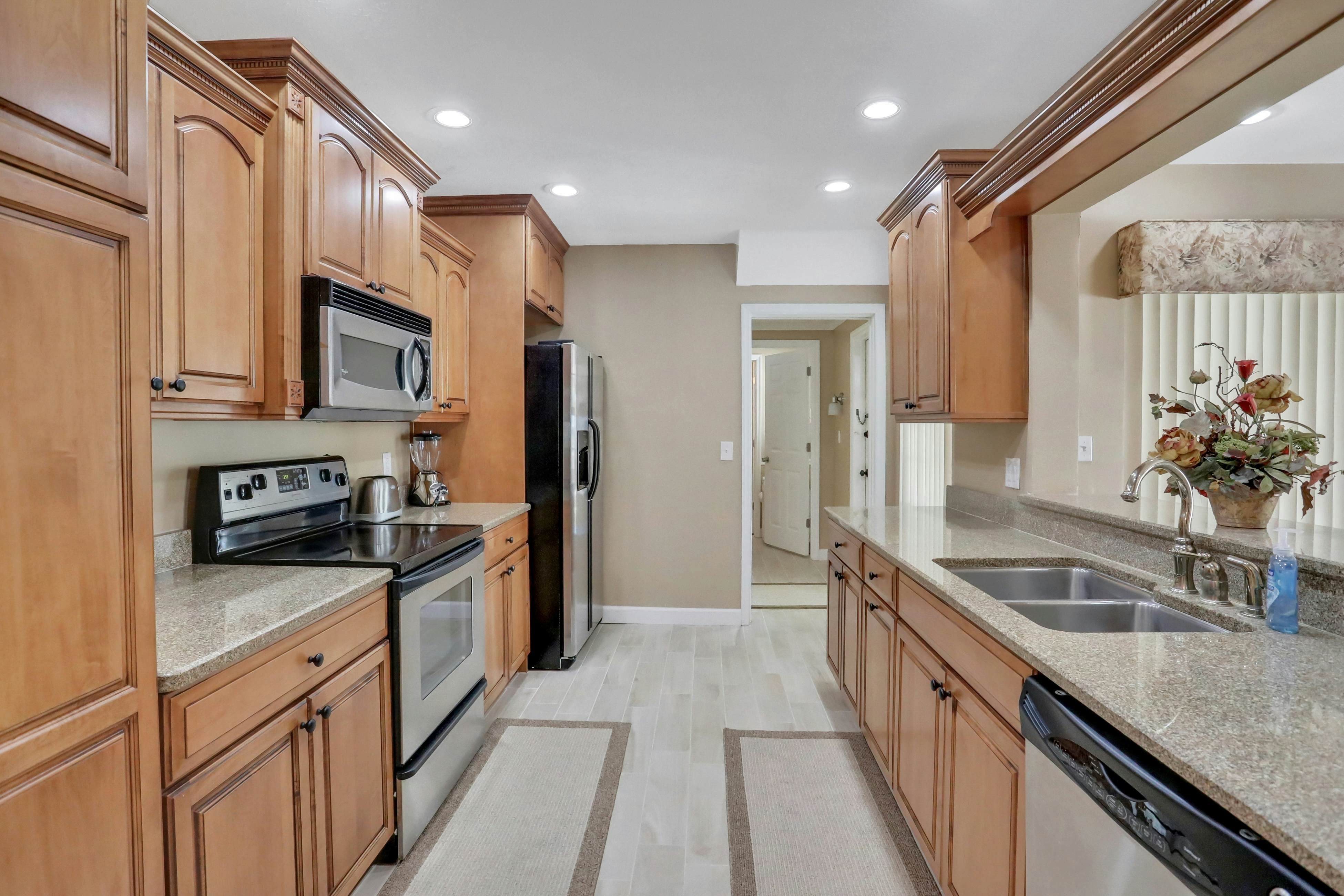 Snowbird-friendly elegant home with waterfront location, pool, grill, fireplace