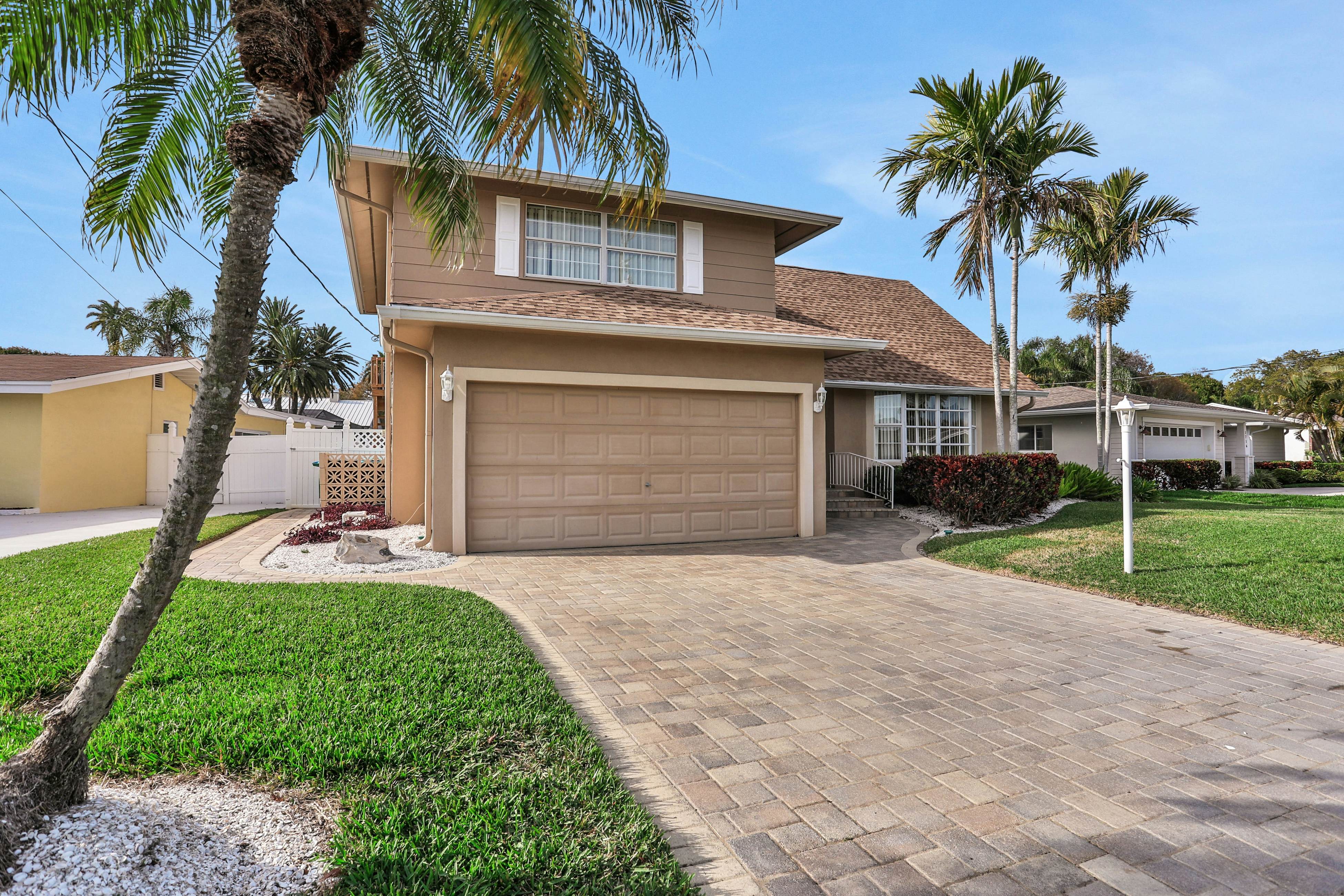 Snowbird-friendly elegant home with waterfront location, pool, grill, fireplace