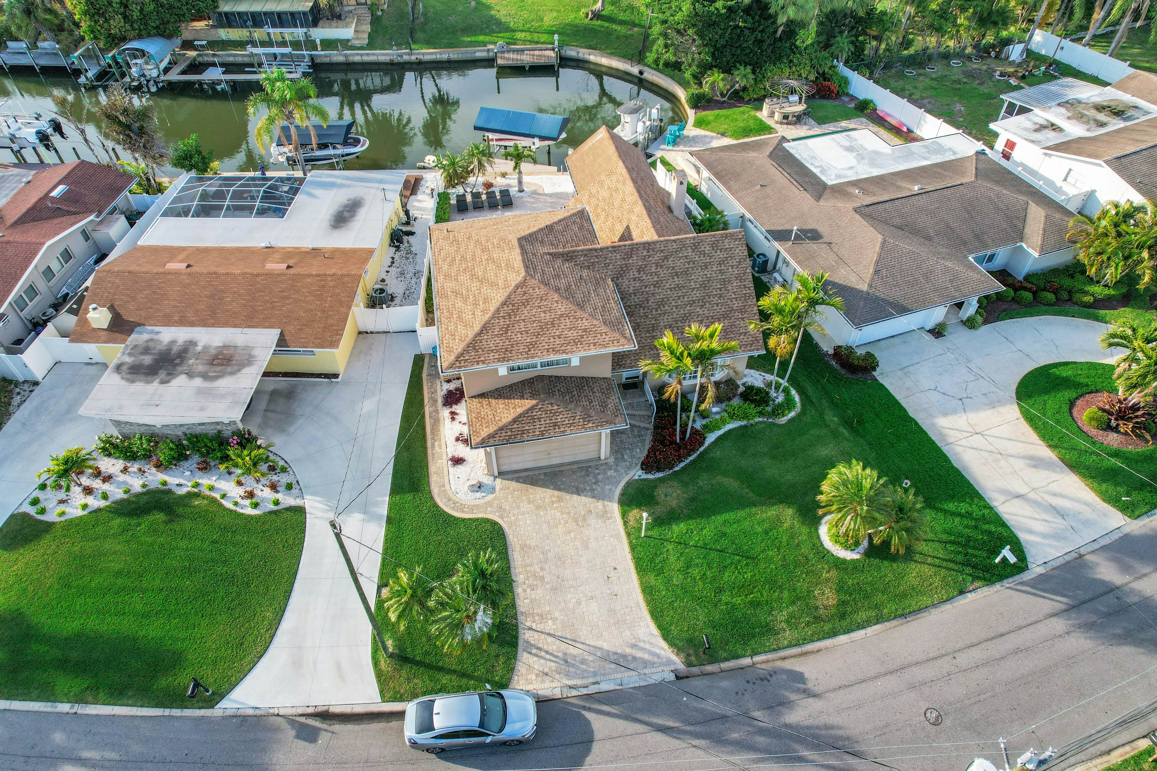 Snowbird-friendly elegant home with waterfront location, pool, grill, fireplace