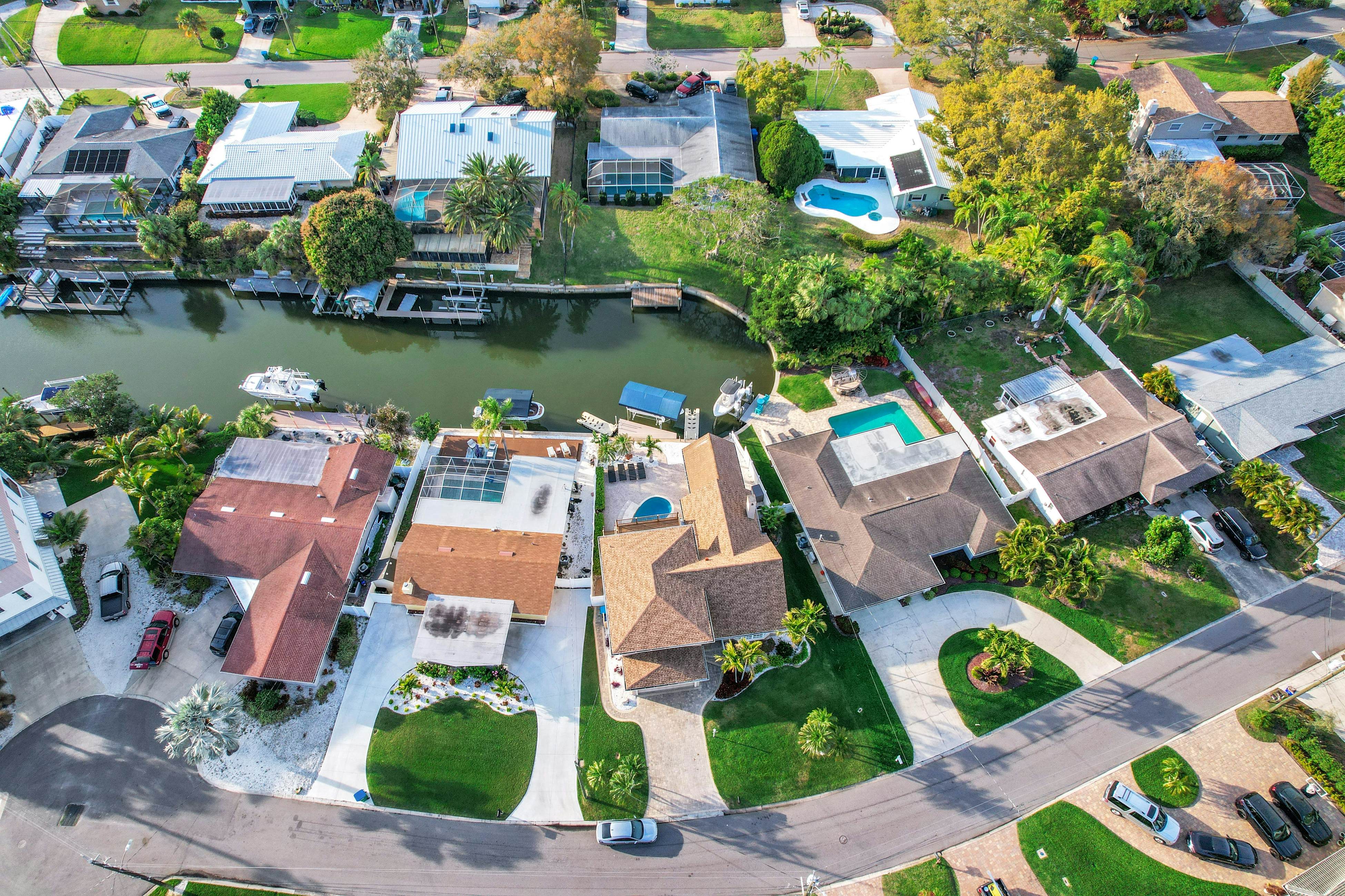 Snowbird-friendly elegant home with waterfront location, pool, grill, fireplace