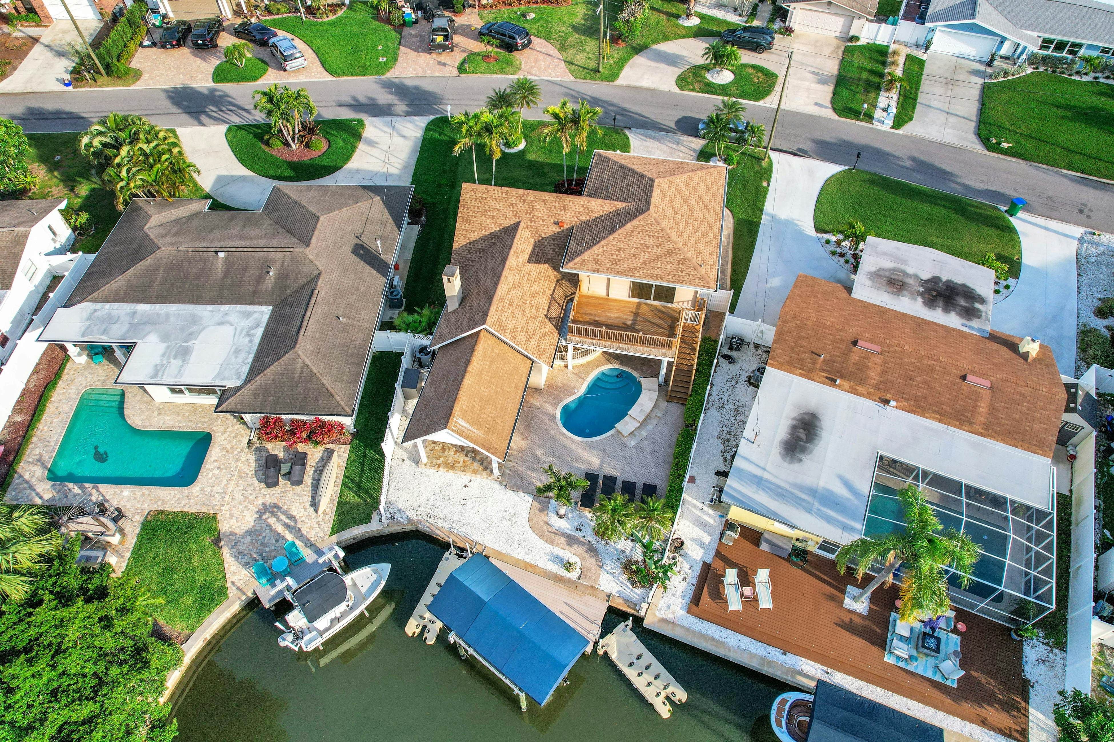 Snowbird-friendly elegant home with waterfront location, pool, grill, fireplace