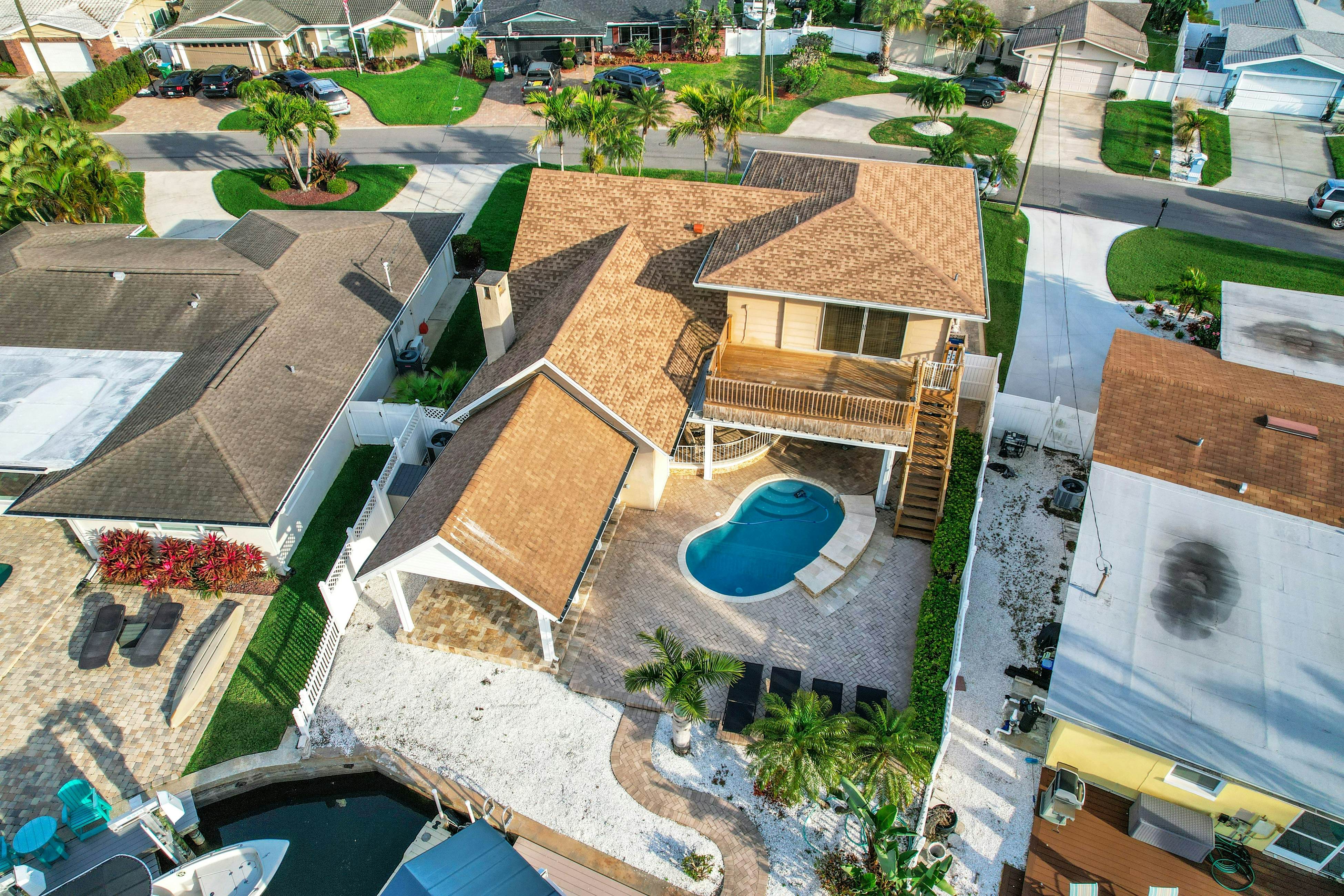 Snowbird-friendly elegant home with waterfront location, pool, grill, fireplace