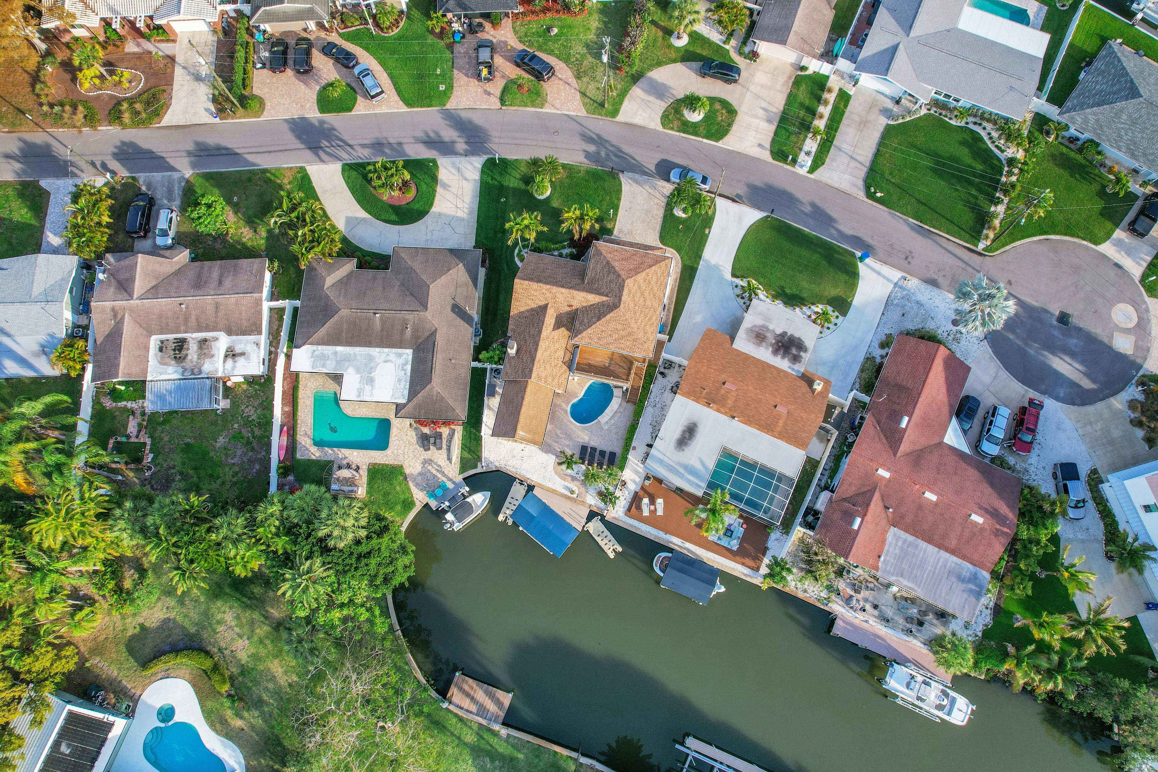 Snowbird-friendly elegant home with waterfront location, pool, grill, fireplace