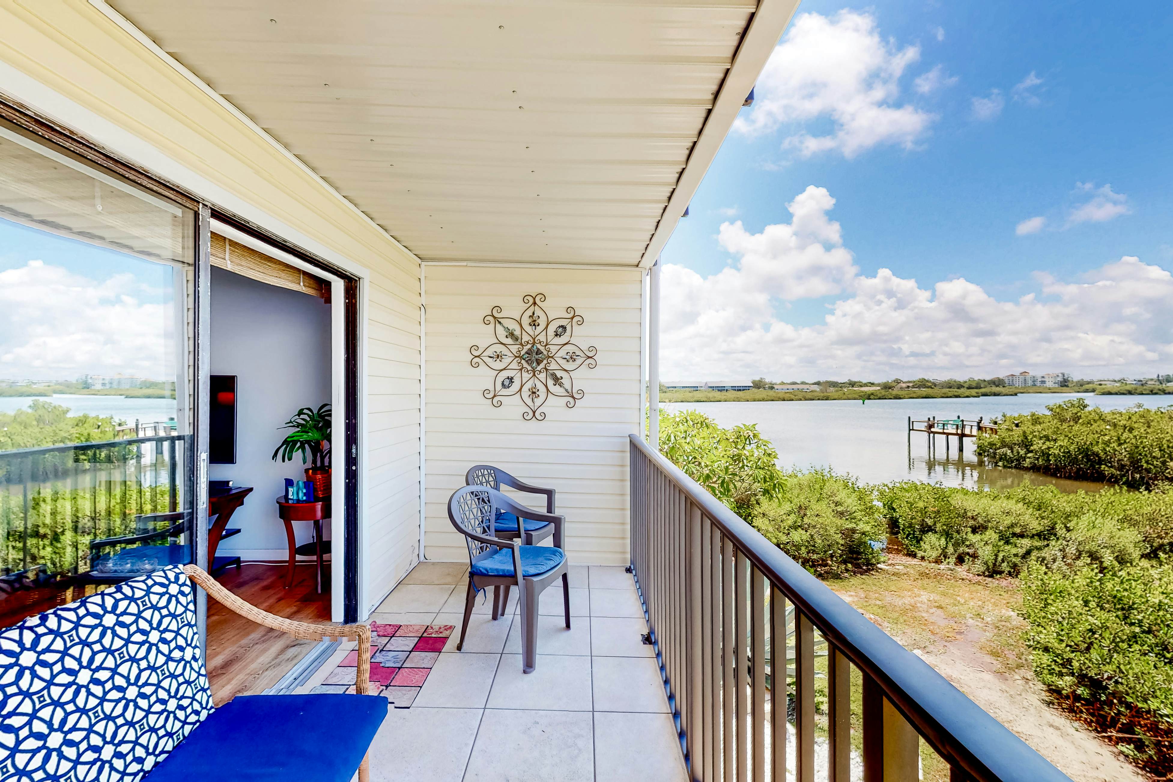 Beachfront condo with balconies, grill, AC, & pool access - steps from the sand