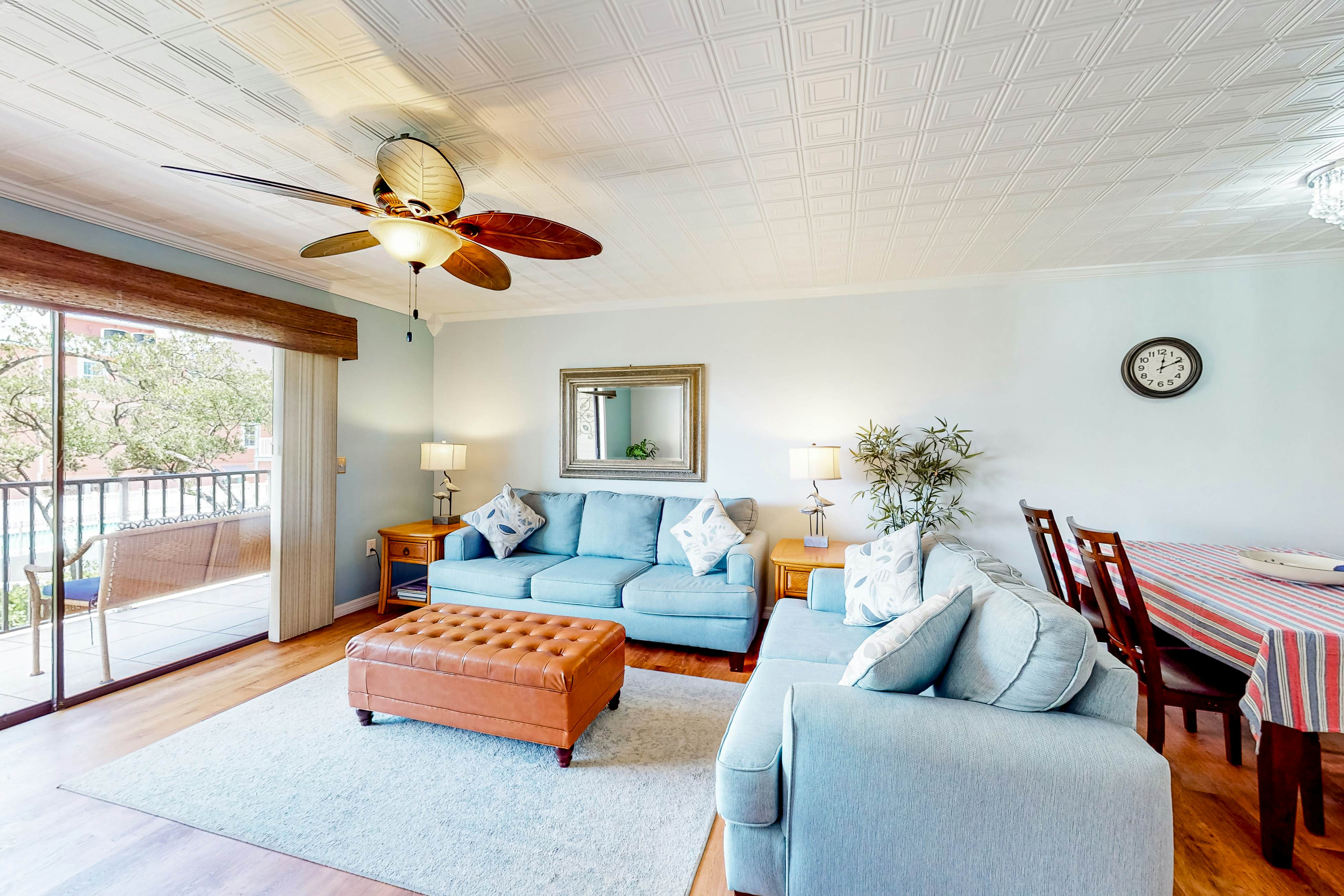 Beachfront condo with balconies, grill, AC, & pool access - steps from the sand