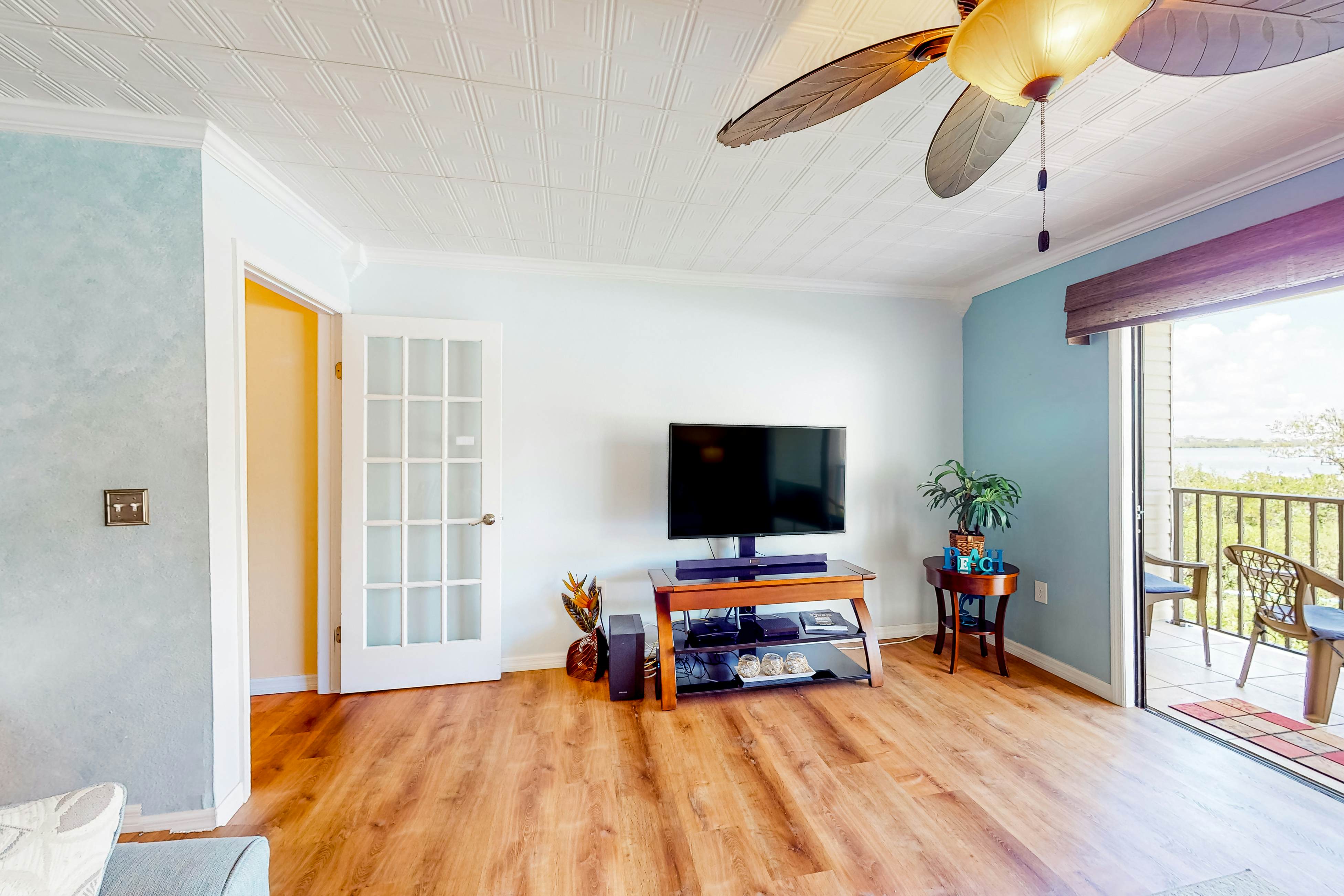 Beachfront condo with balconies, grill, AC, & pool access - steps from the sand