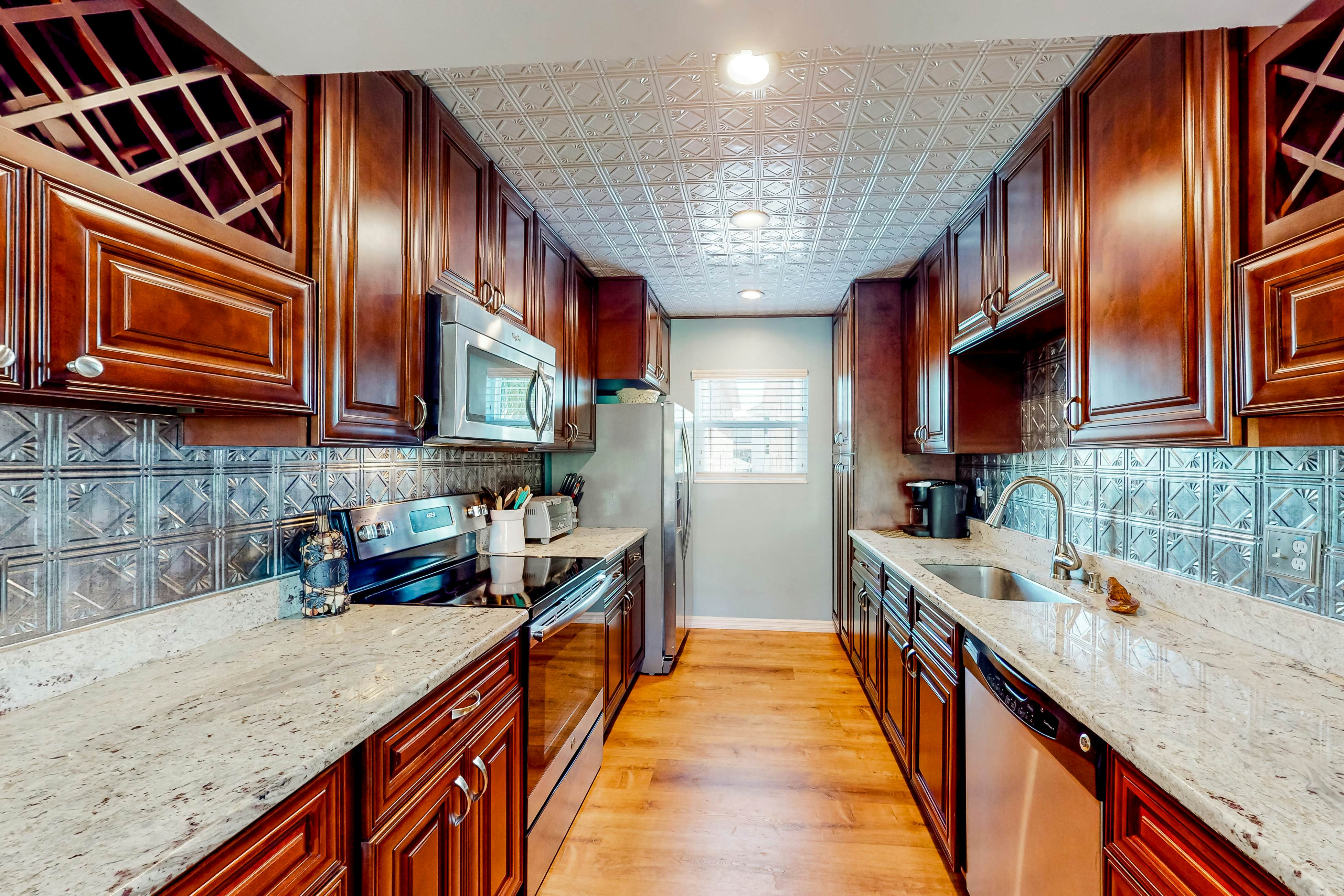 Beachfront condo with balconies, grill, AC, & pool access - steps from the sand