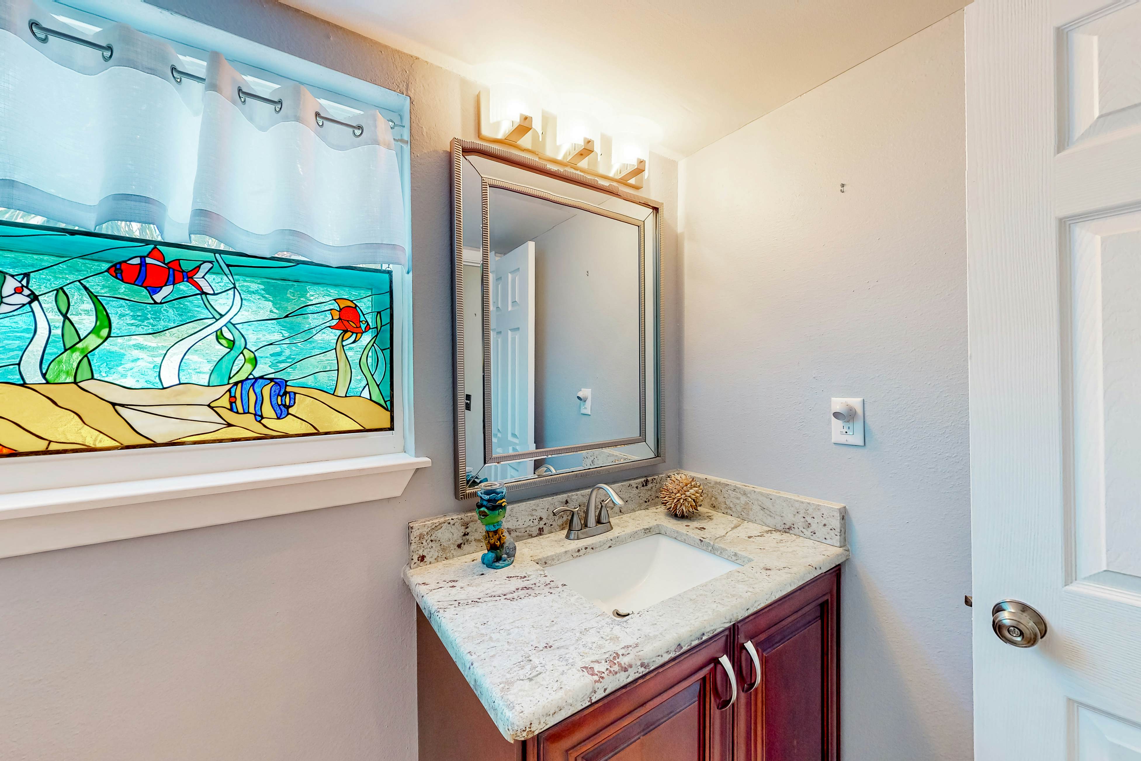 Beachfront condo with balconies, grill, AC, & pool access - steps from the sand