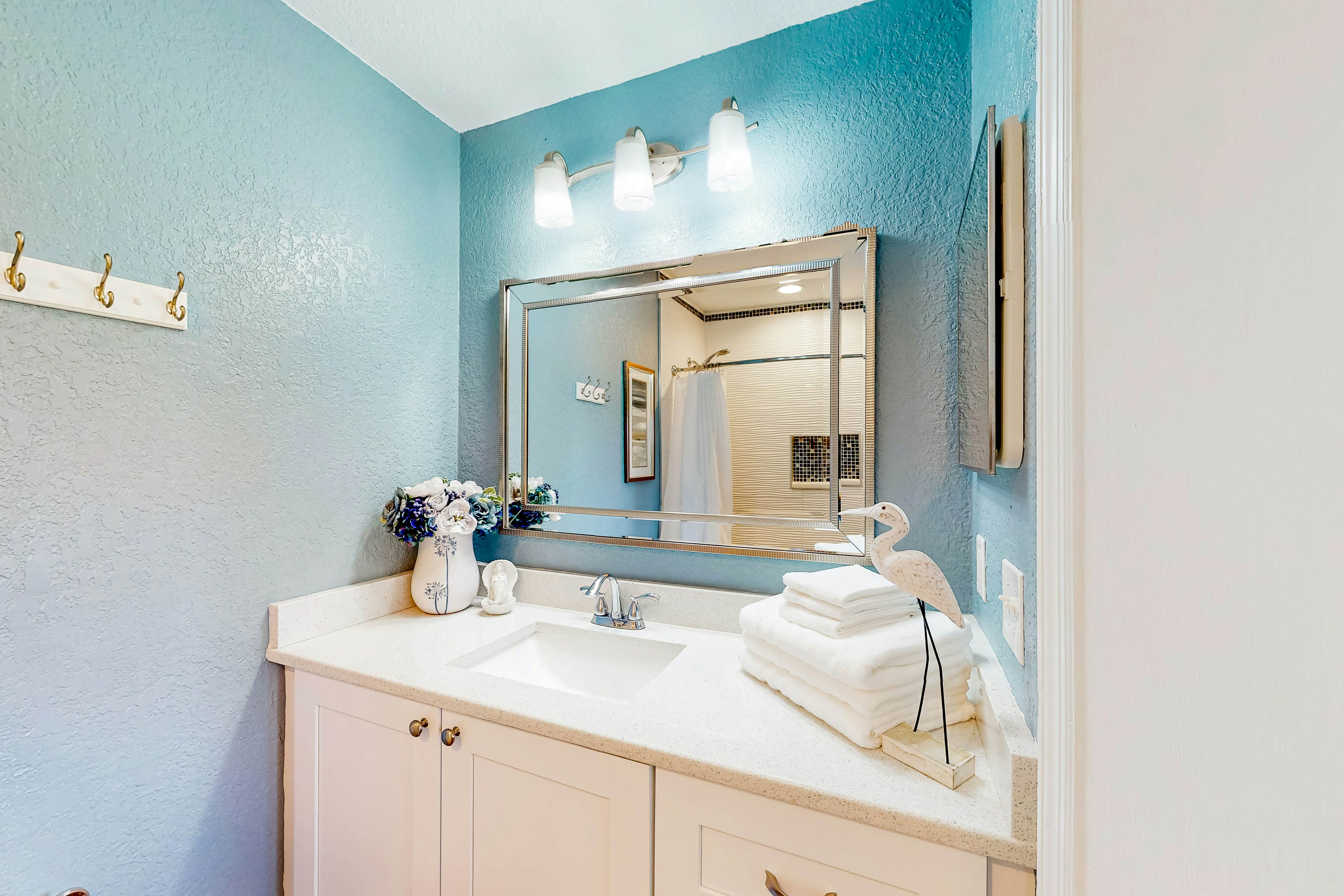 Beachfront condo with balconies, grill, AC, & pool access - steps from the sand