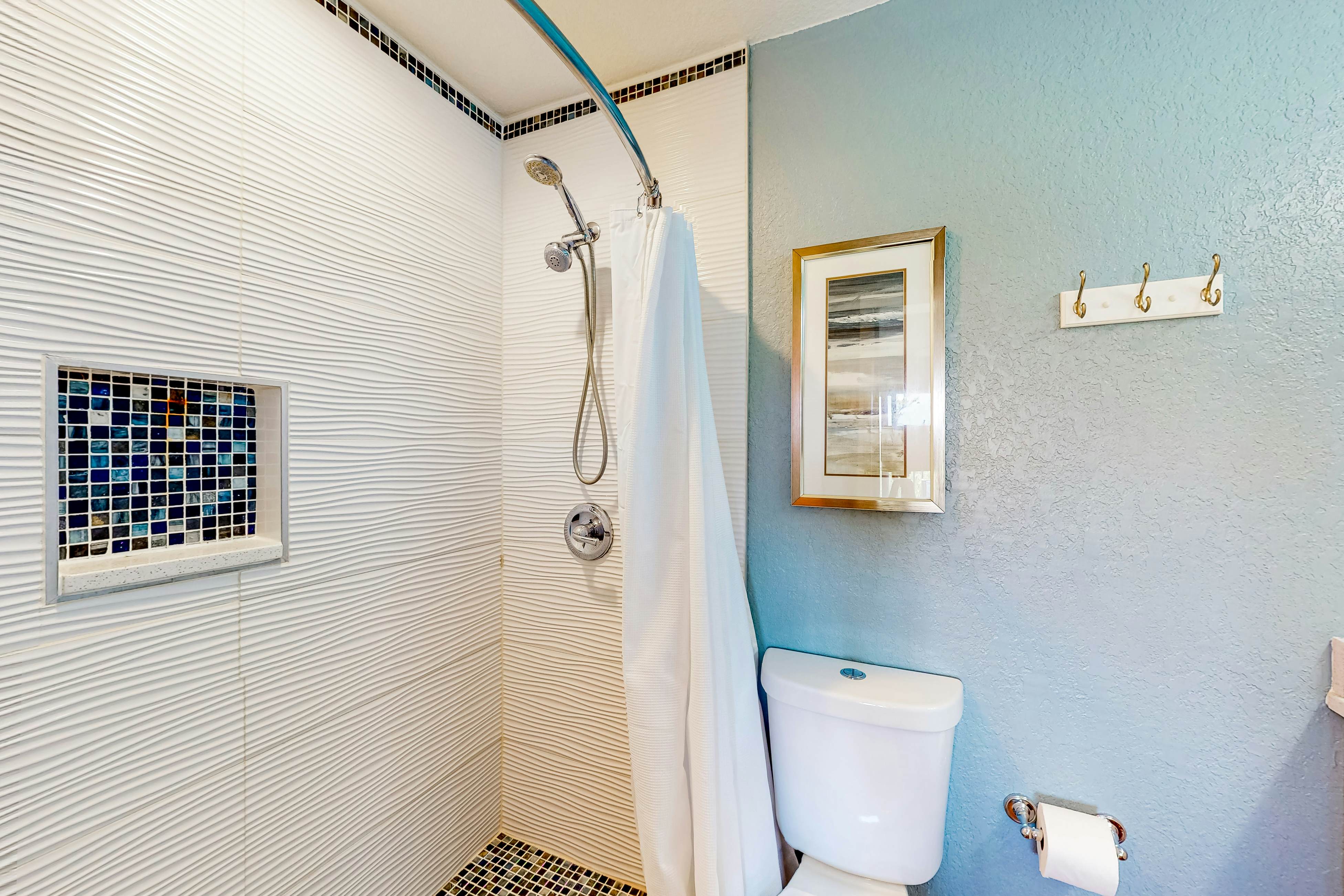 Beachfront condo with balconies, grill, AC, & pool access - steps from the sand