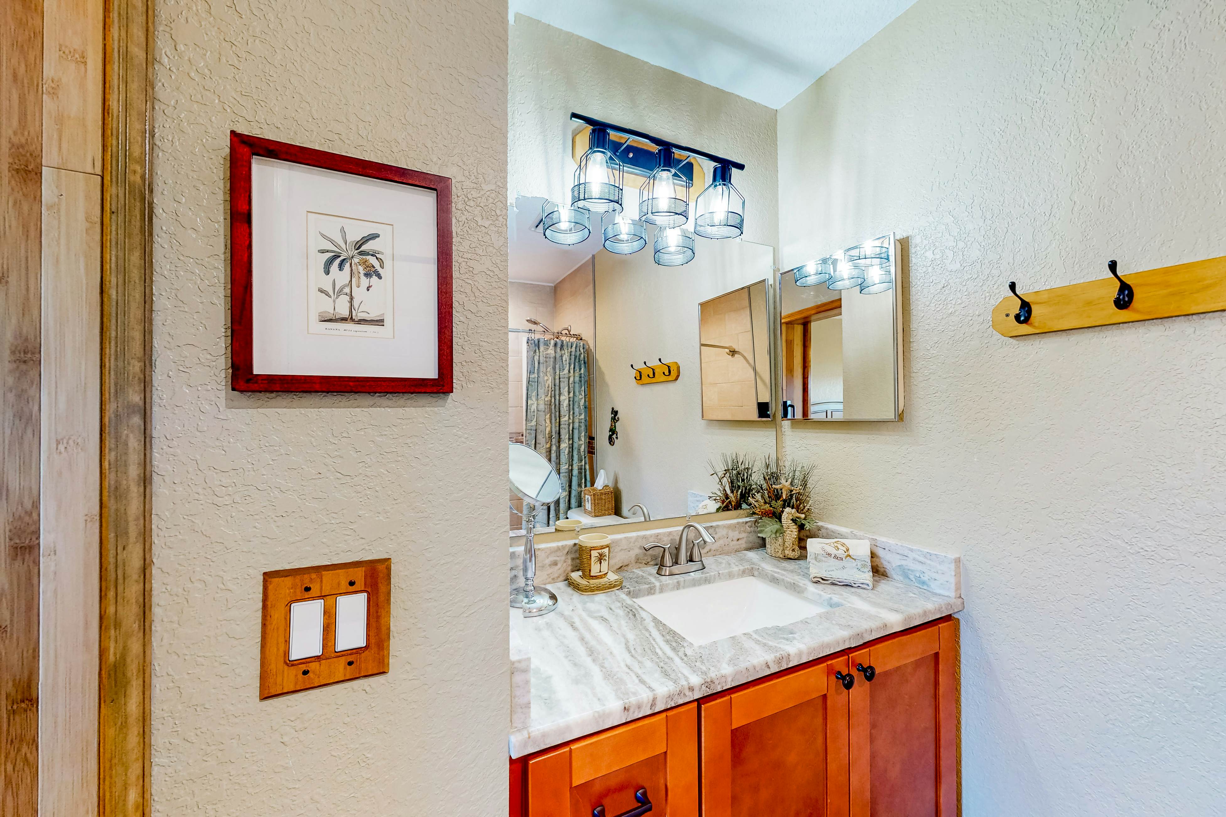 Beachfront condo with balconies, grill, AC, & pool access - steps from the sand