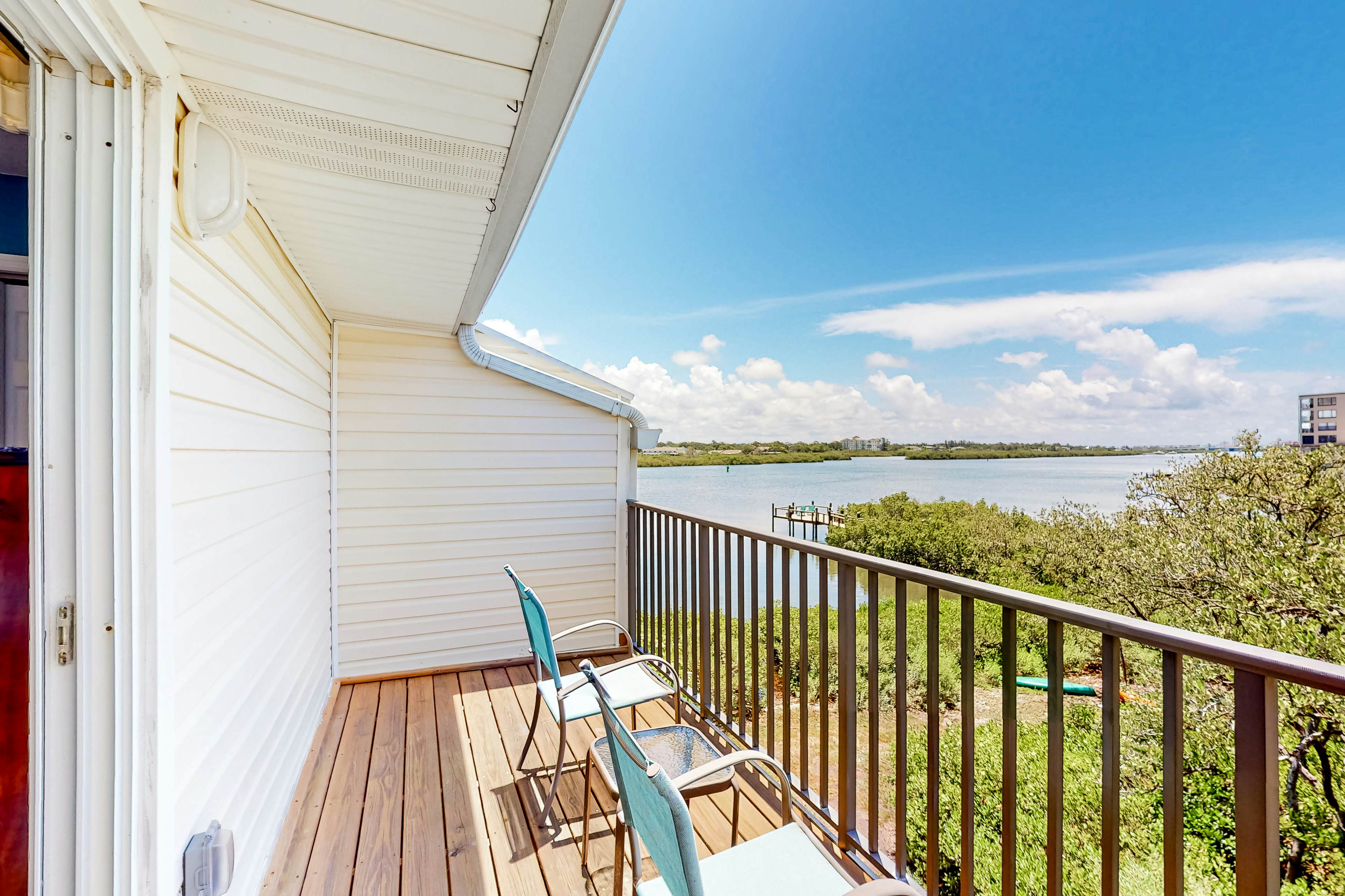 Beachfront condo with balconies, grill, AC, & pool access - steps from the sand