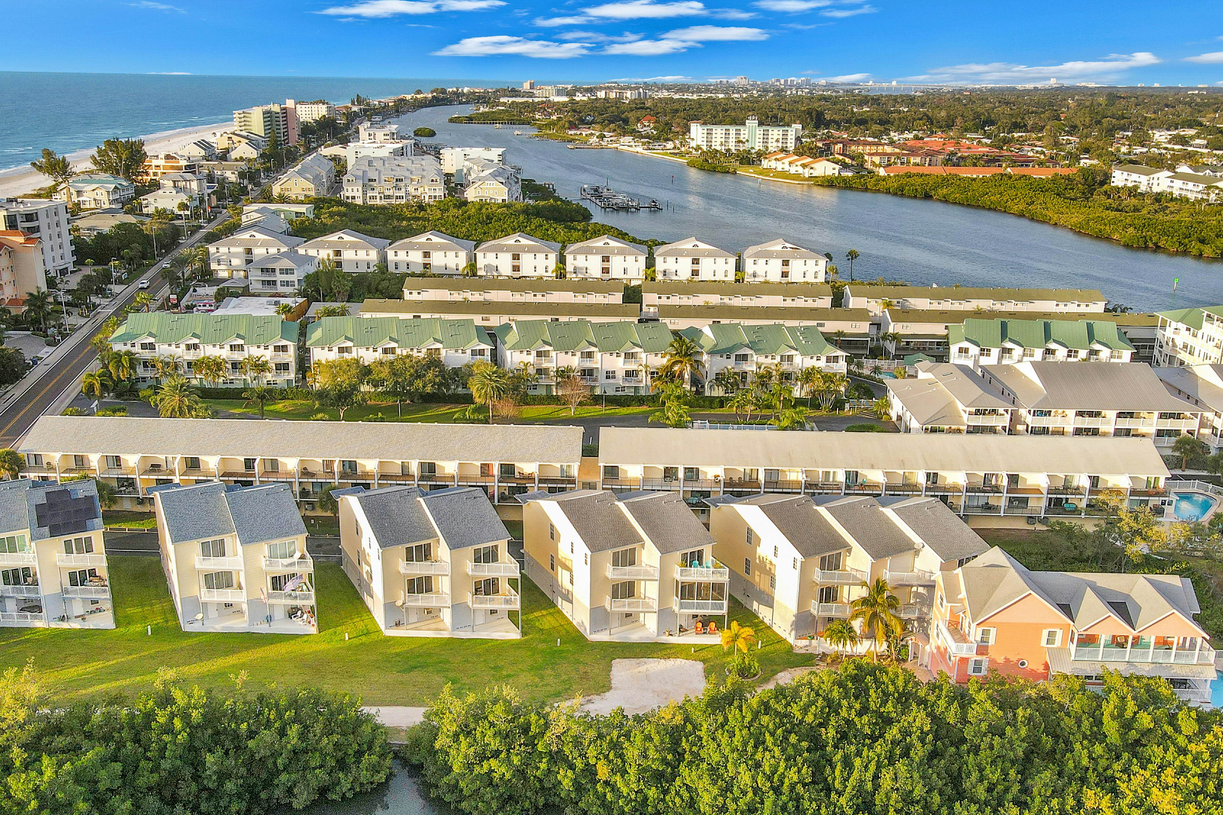 Beachfront condo with balconies, grill, AC, & pool access - steps from the sand