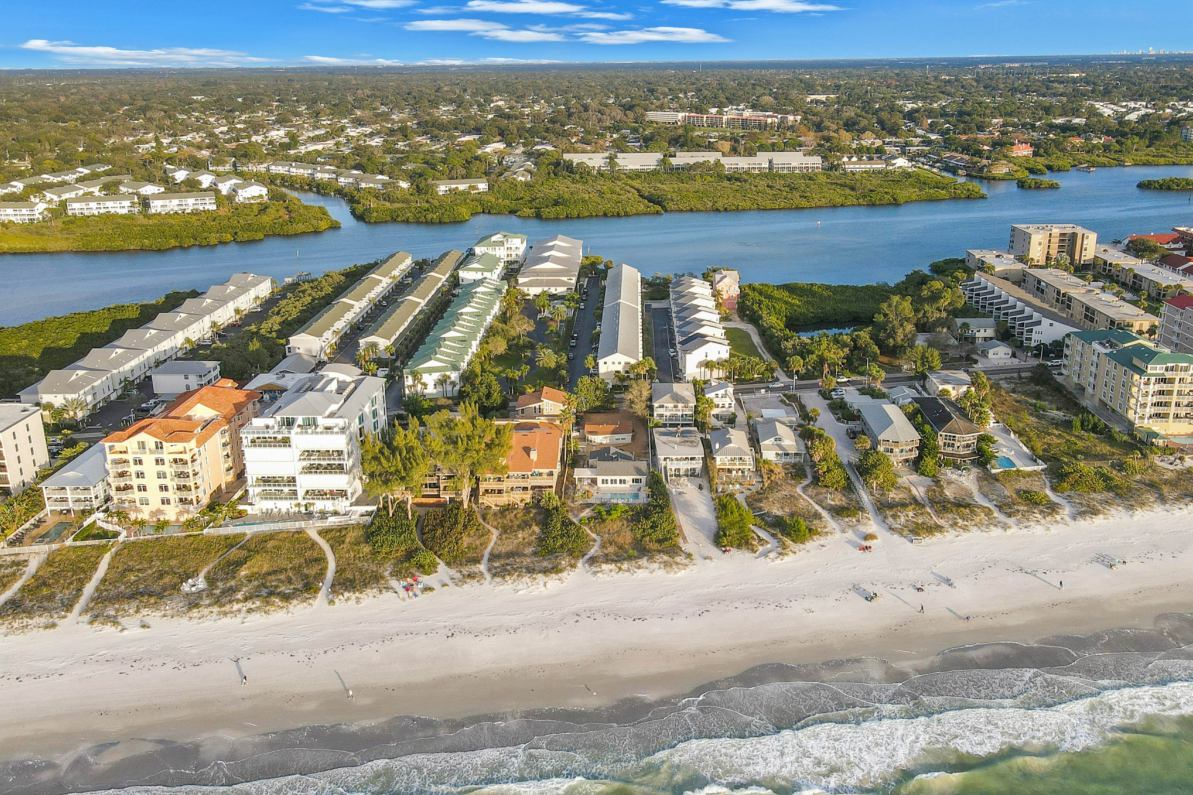 Beachfront condo with balconies, grill, AC, & pool access - steps from the sand