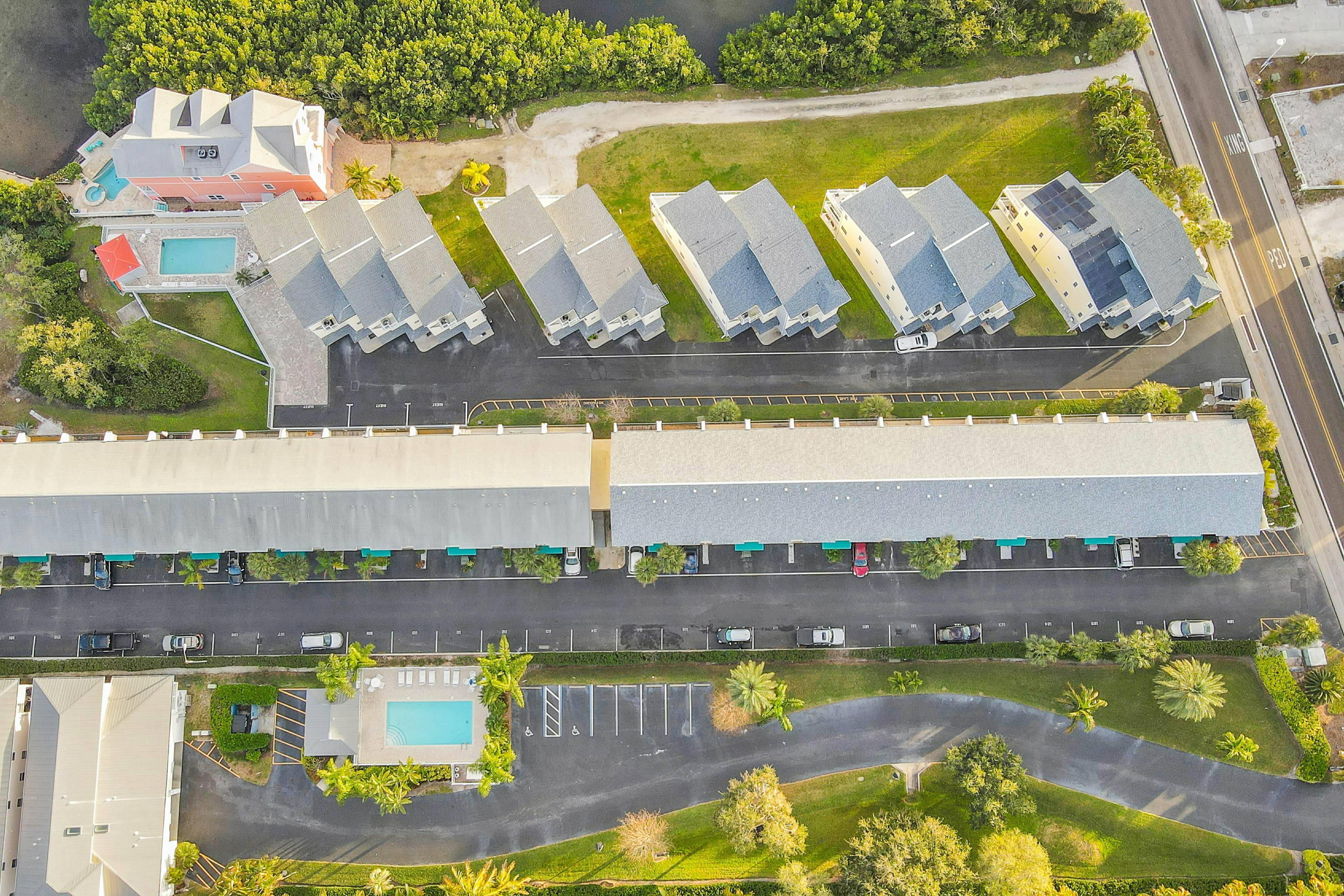 Beachfront condo with balconies, grill, AC, & pool access - steps from the sand