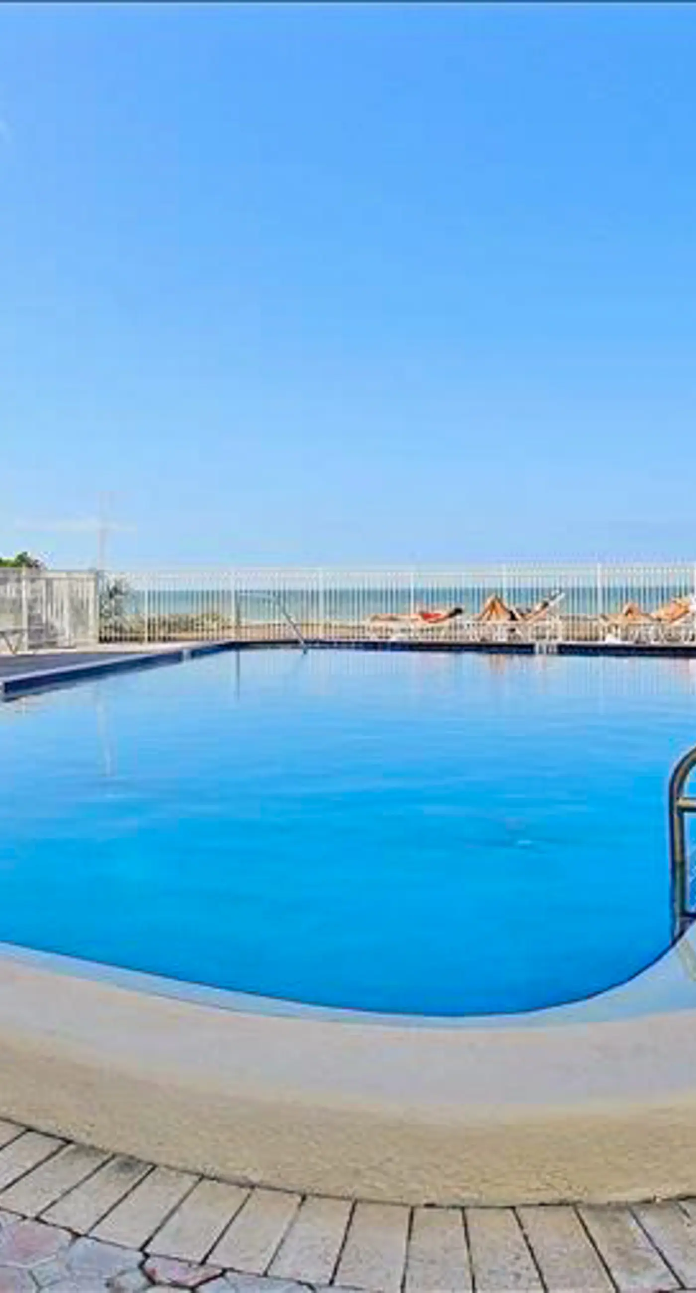 Spacious beachfront condo with lovely Gulf views balcony heated pool and AC