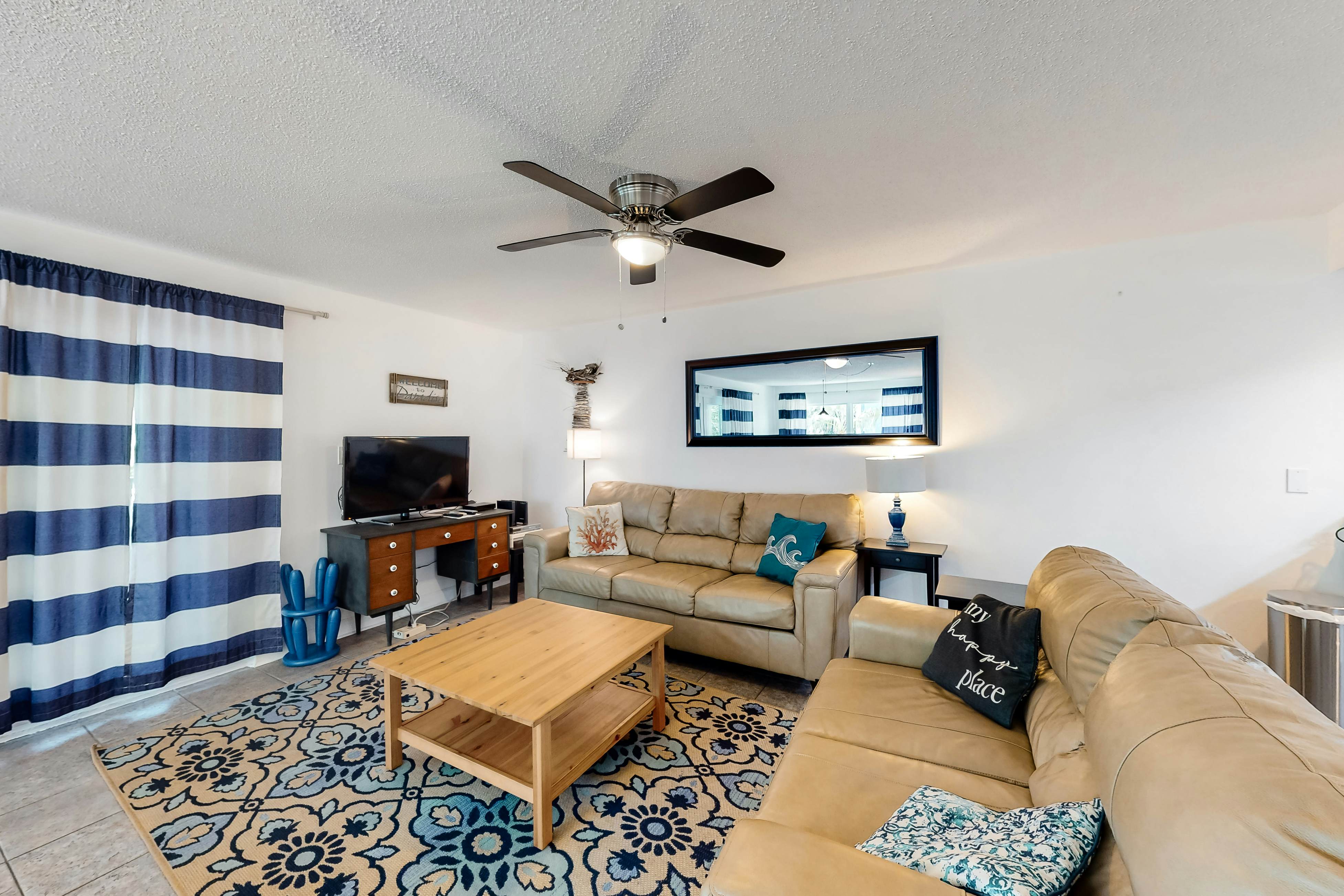 Updated beachside corner condo with pool and private wraparound balcony