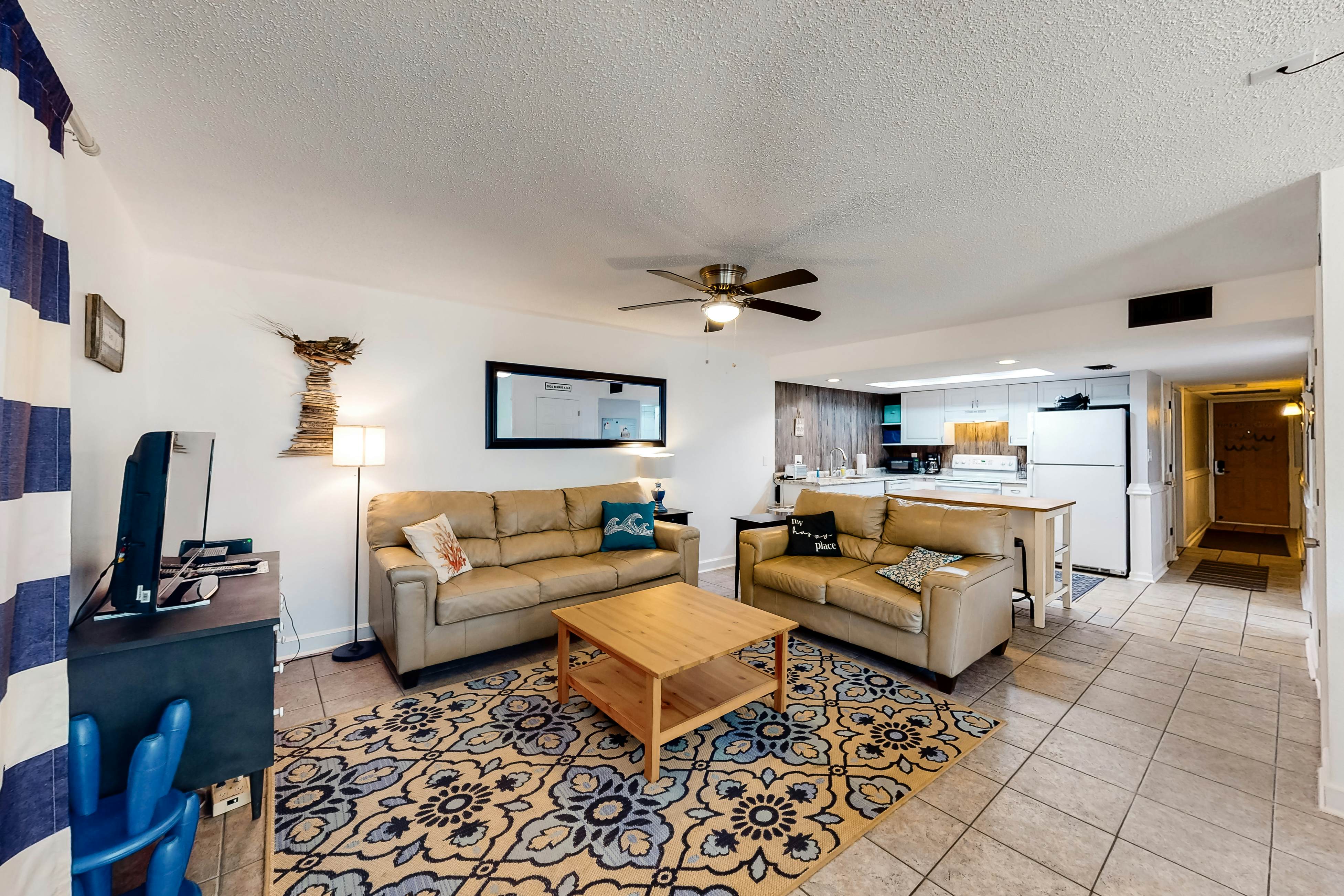 Updated beachside corner condo with pool and private wraparound balcony