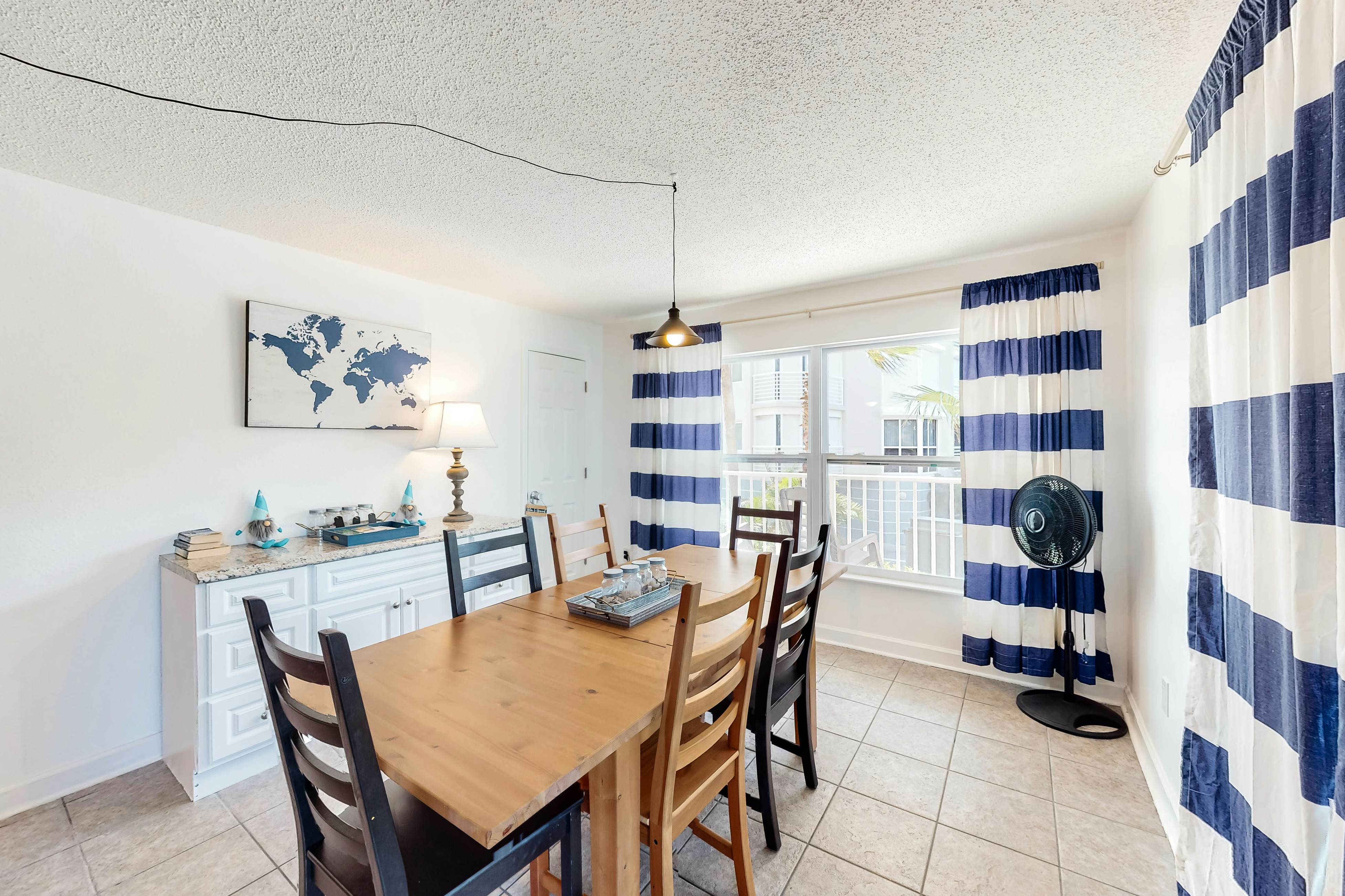 Updated beachside corner condo with pool and private wraparound balcony