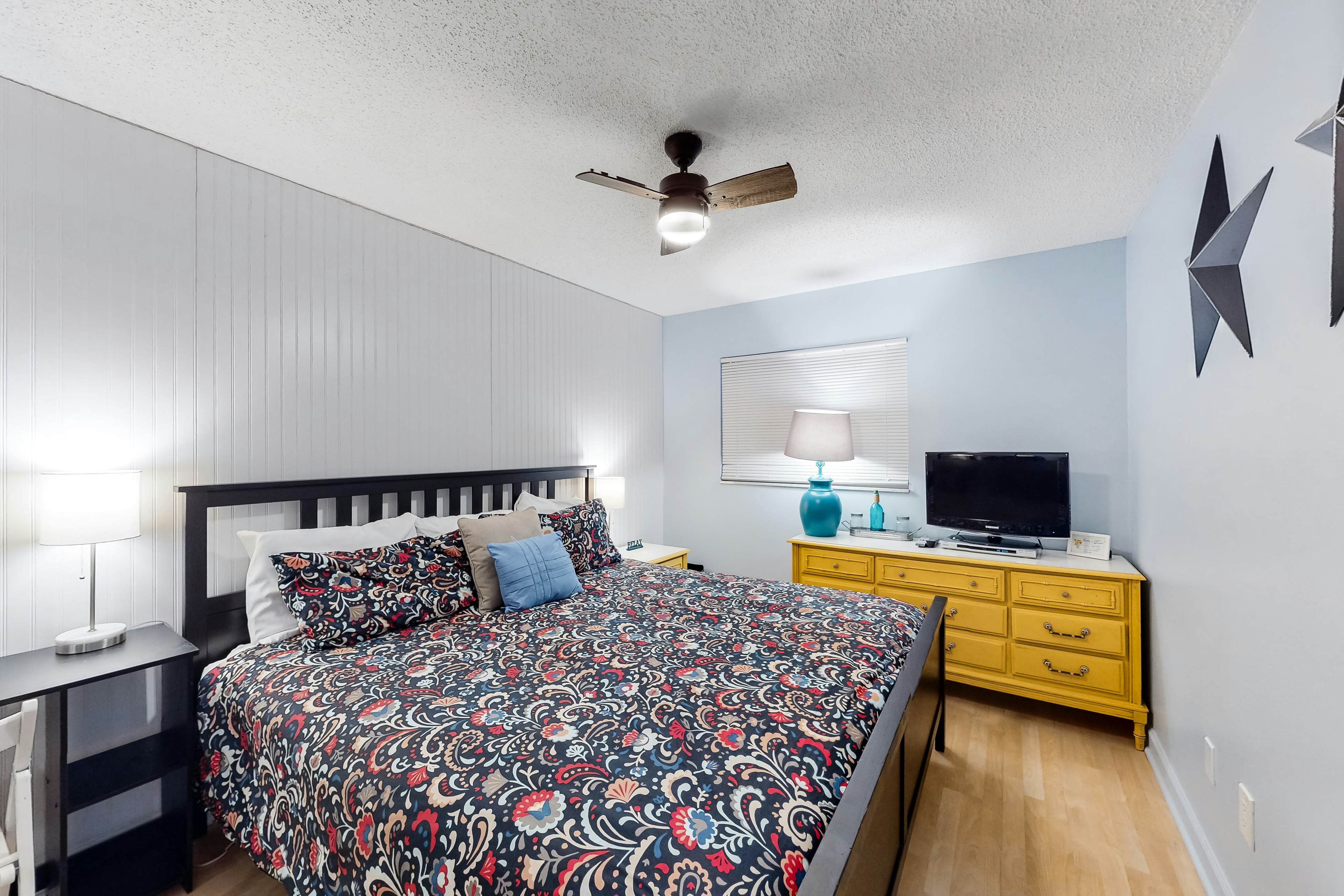 Updated beachside corner condo with pool and private wraparound balcony