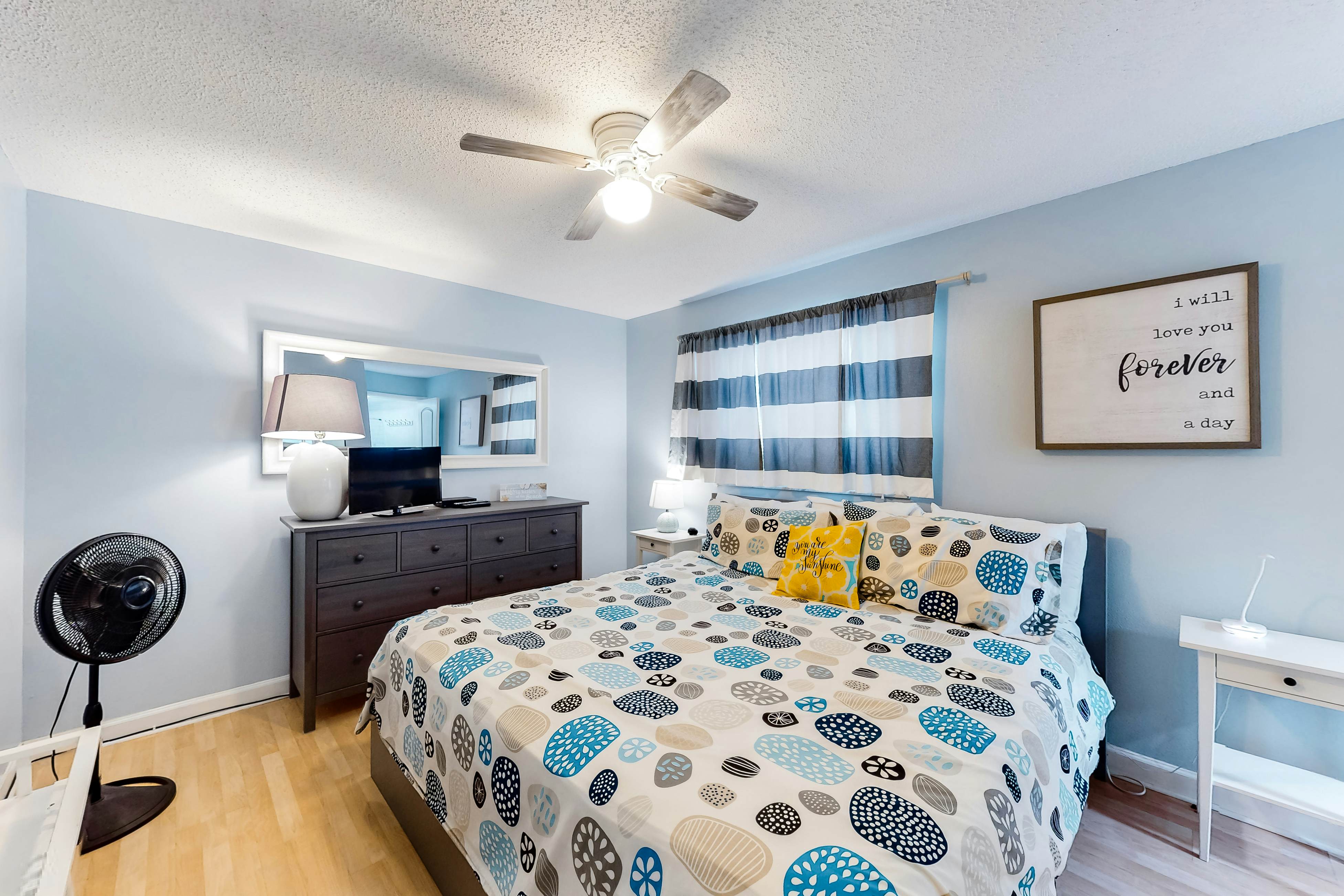 Updated beachside corner condo with pool and private wraparound balcony