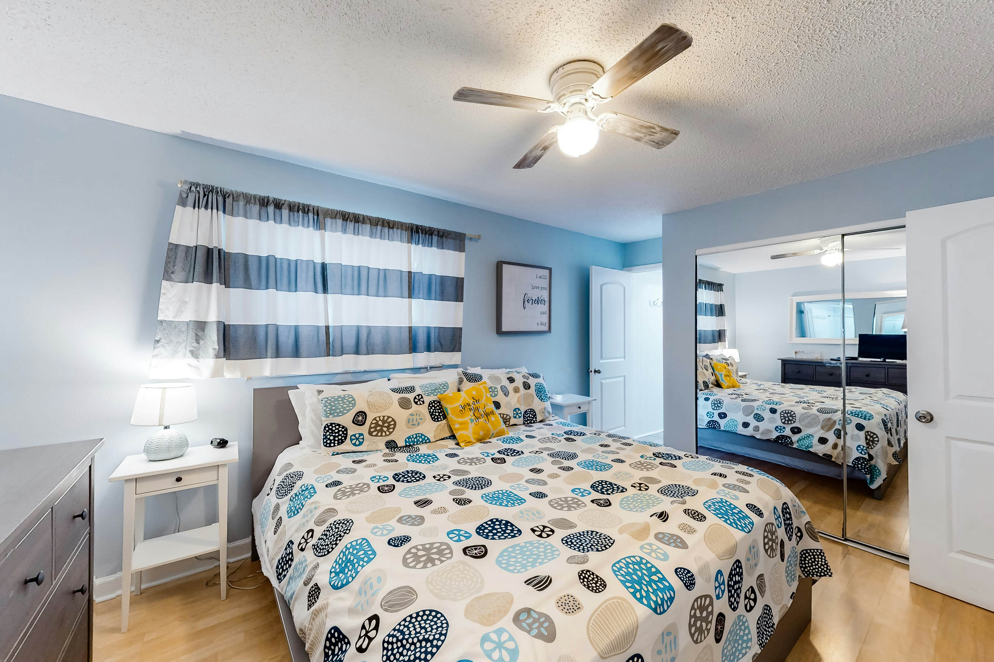 Updated beachside corner condo with pool and private wraparound balcony