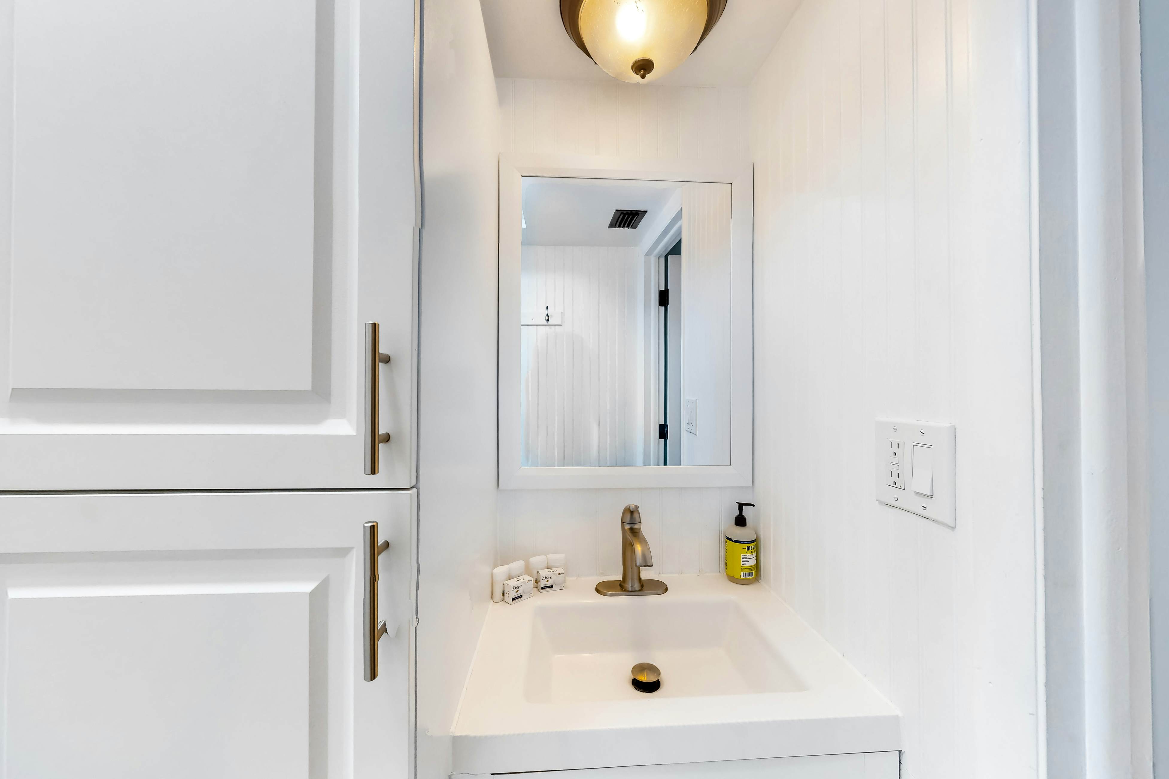 Updated beachside corner condo with pool and private wraparound balcony