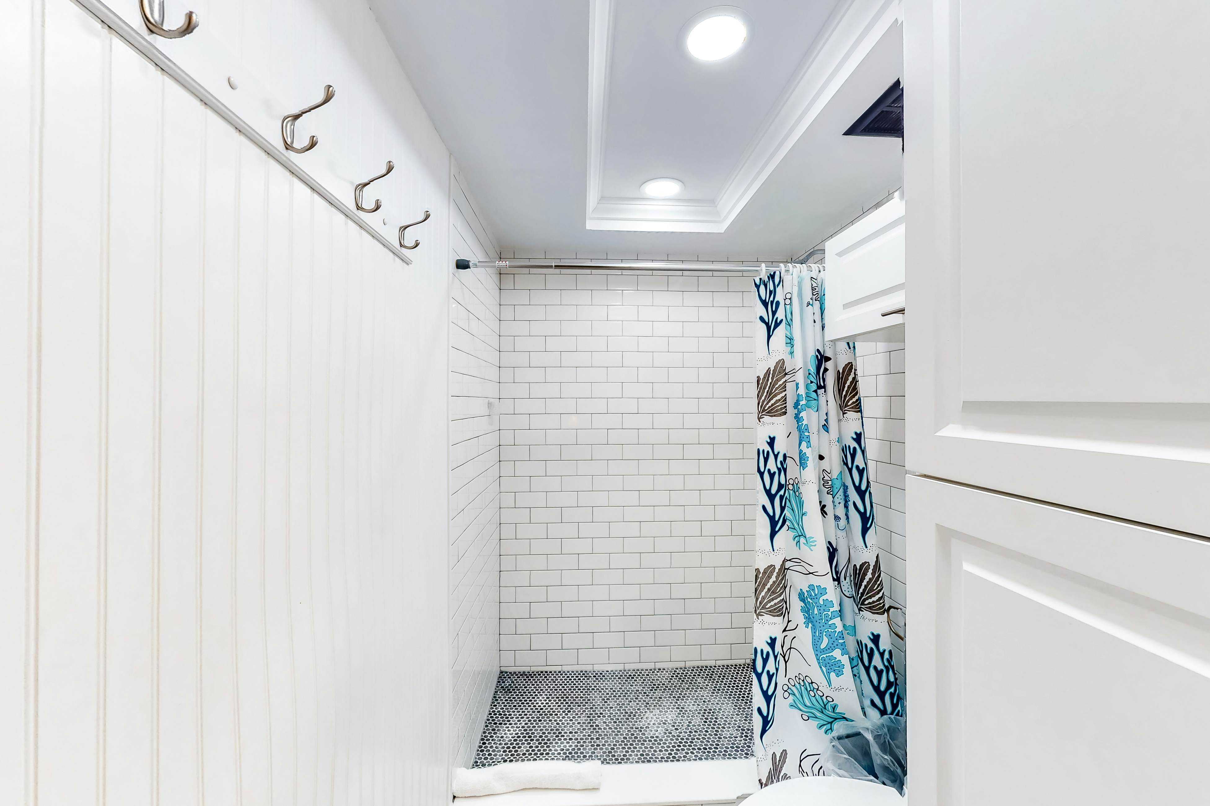 Updated beachside corner condo with pool and private wraparound balcony