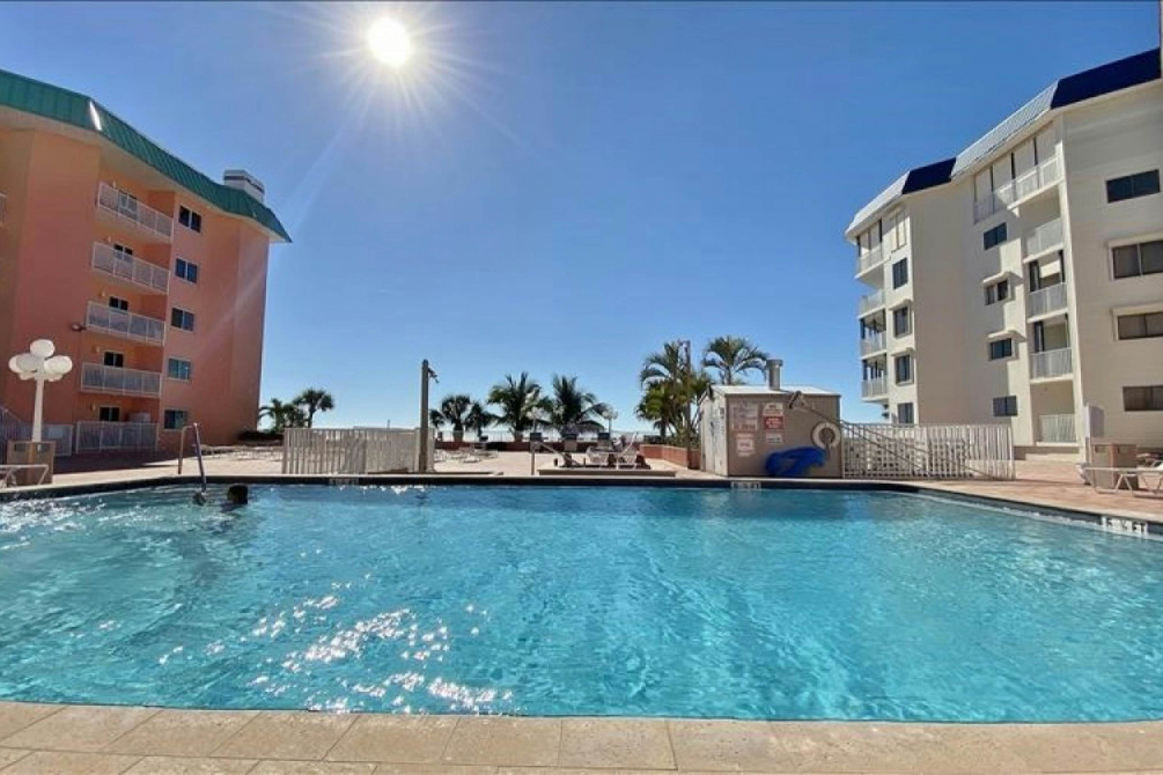 Modern cottage with peek-a-boo side Gulf view & beachfront heated pool & spa