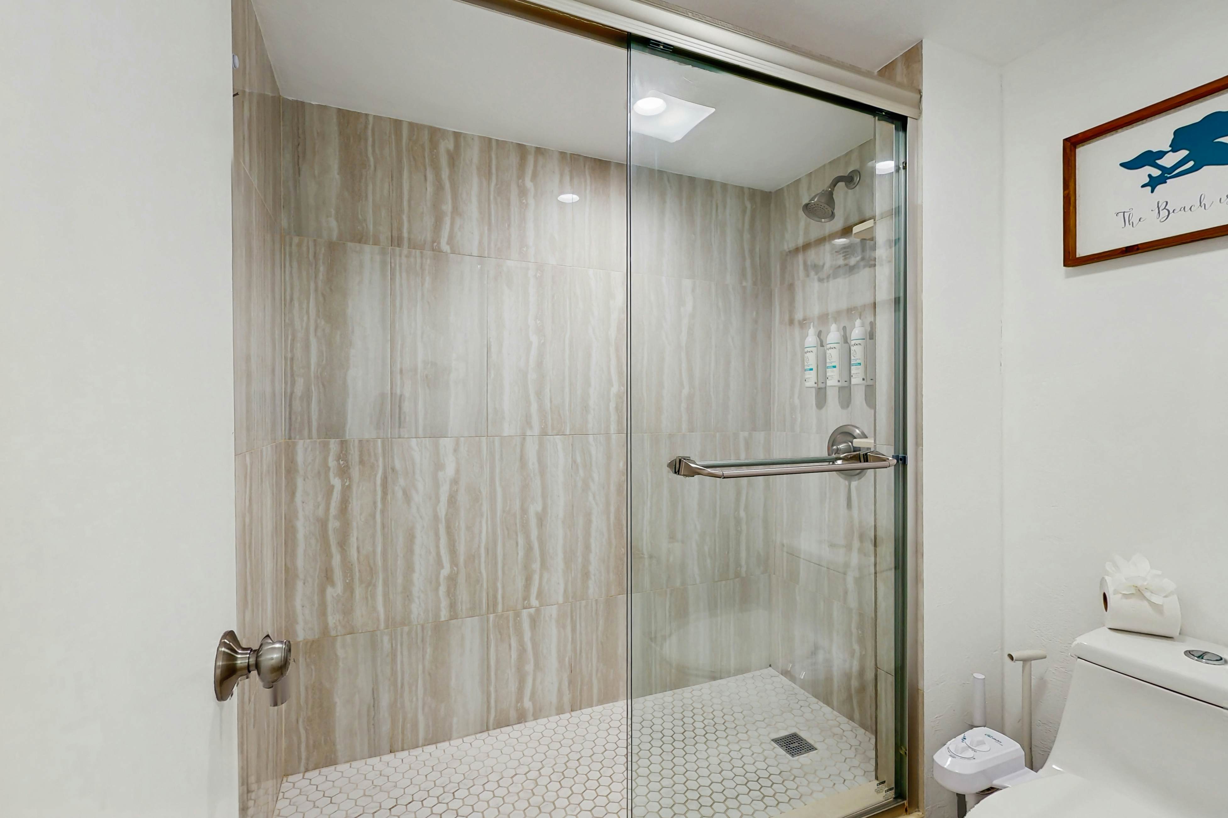 Modern cottage with peek-a-boo side Gulf view & beachfront heated pool & spa