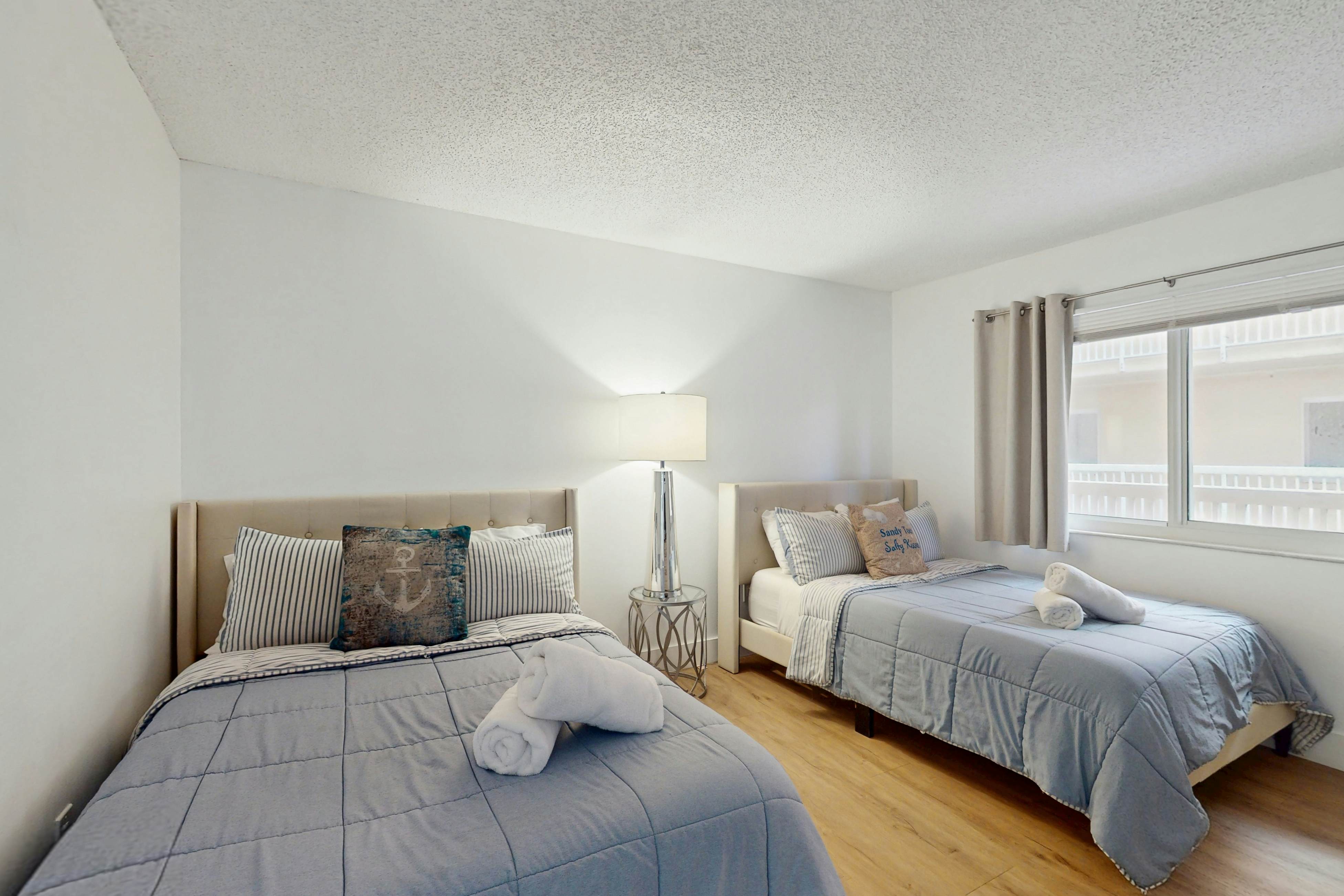 Modern cottage with peek-a-boo side Gulf view & beachfront heated pool & spa