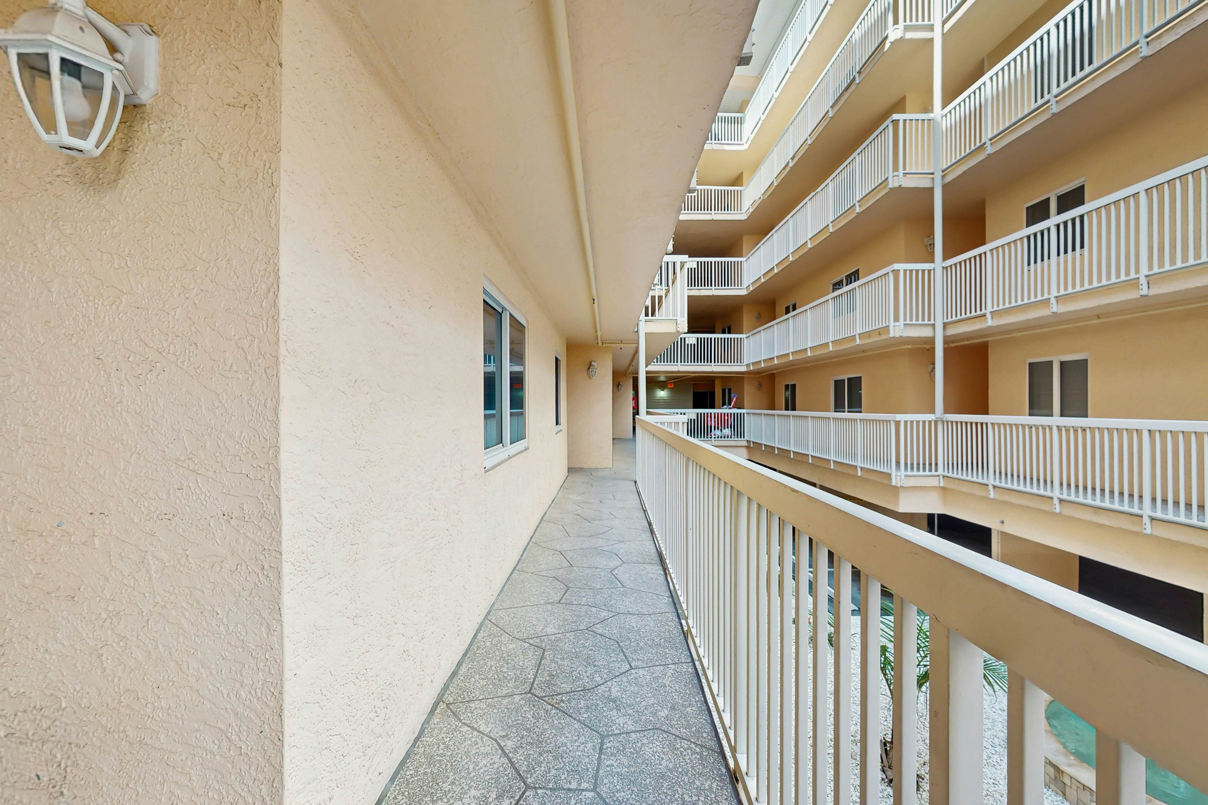 Modern cottage with peek-a-boo side Gulf view & beachfront heated pool & spa